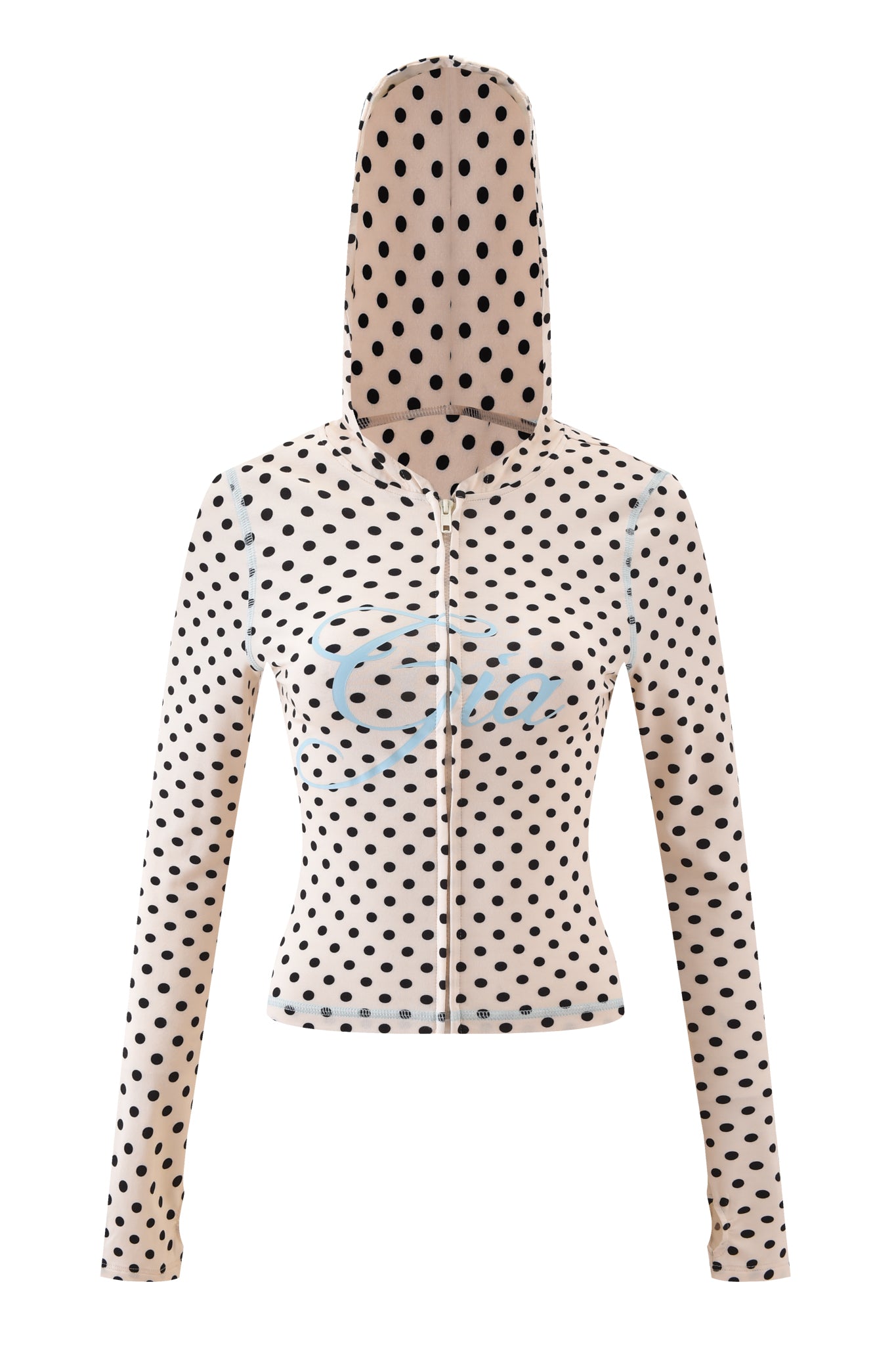 The BLARE HOODIE - CREAM POLKA DOT by I.AM.GIA features beige long sleeves, black polka dots, a fitted waist, and blue Gia logo text across the chest. Displayed on a white background.