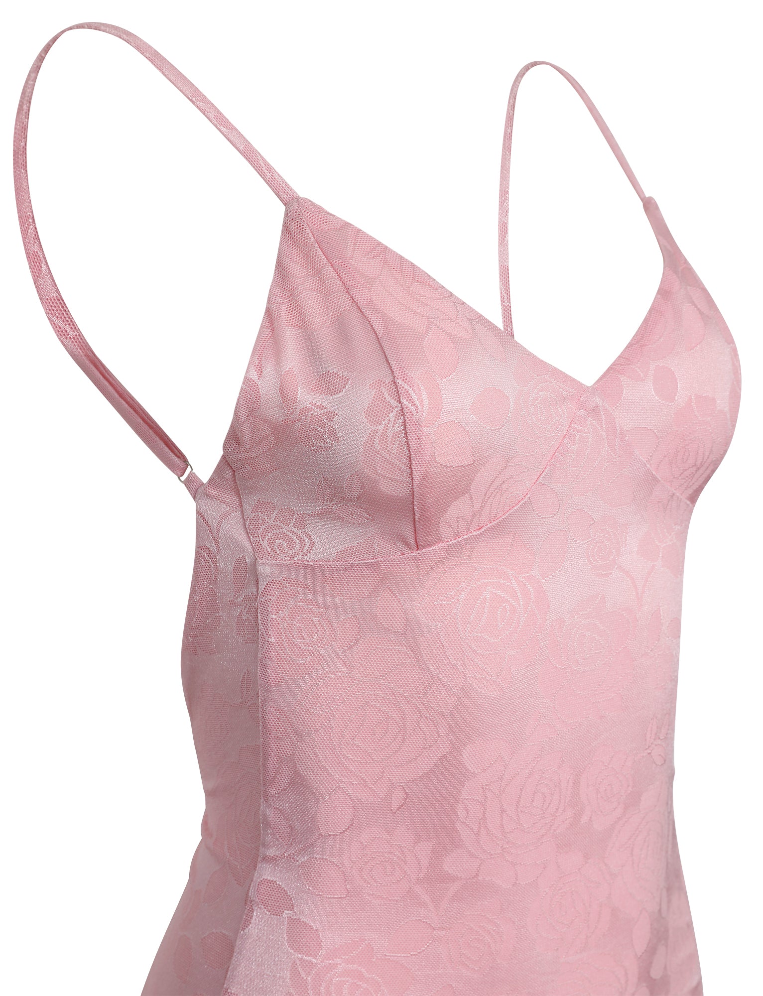A close-up image of the TIGERMIST ERICKA DRESS - PINK, showcasing its delicate floral patterns on pink satin. The dress features thin spaghetti straps and a V-neckline, highlighting its elegant and refined design.
