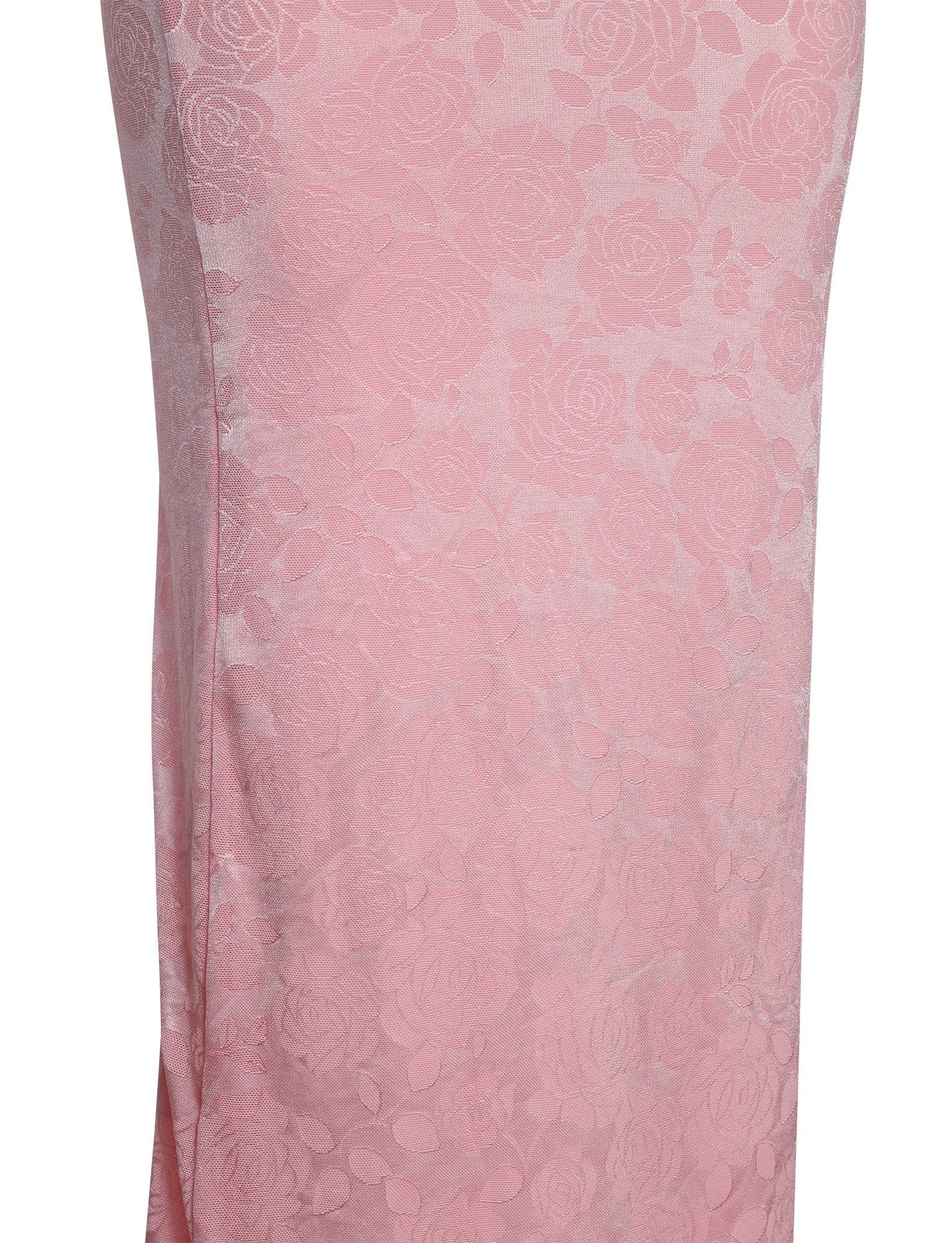 A close-up view of the ERICKA DRESS - PINK from TIGERMIST, showcasing a knee-length design adorned with a subtle floral pattern woven into the fabric. The delicate and elegant style is complemented by an overall smooth texture.