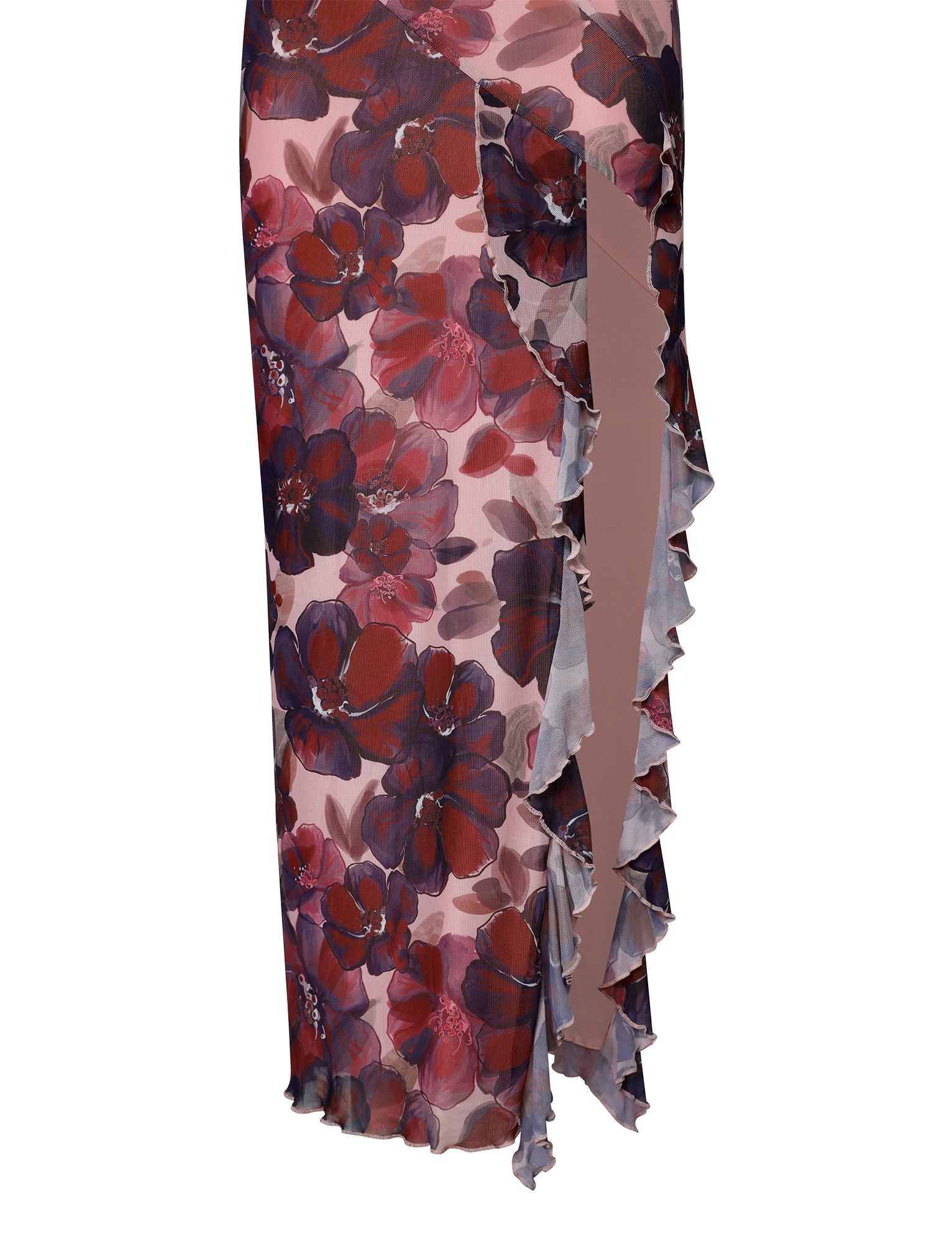 A close-up view of the TIGERMIST Theo Maxi Dress in the Romantic Macro Floral pattern, showcasing shades of red, purple, and pink. The dress has a semi-sheer appearance with an asymmetrical ruffled slit on the right side, featuring delicate layers of fabric and an intricate design.