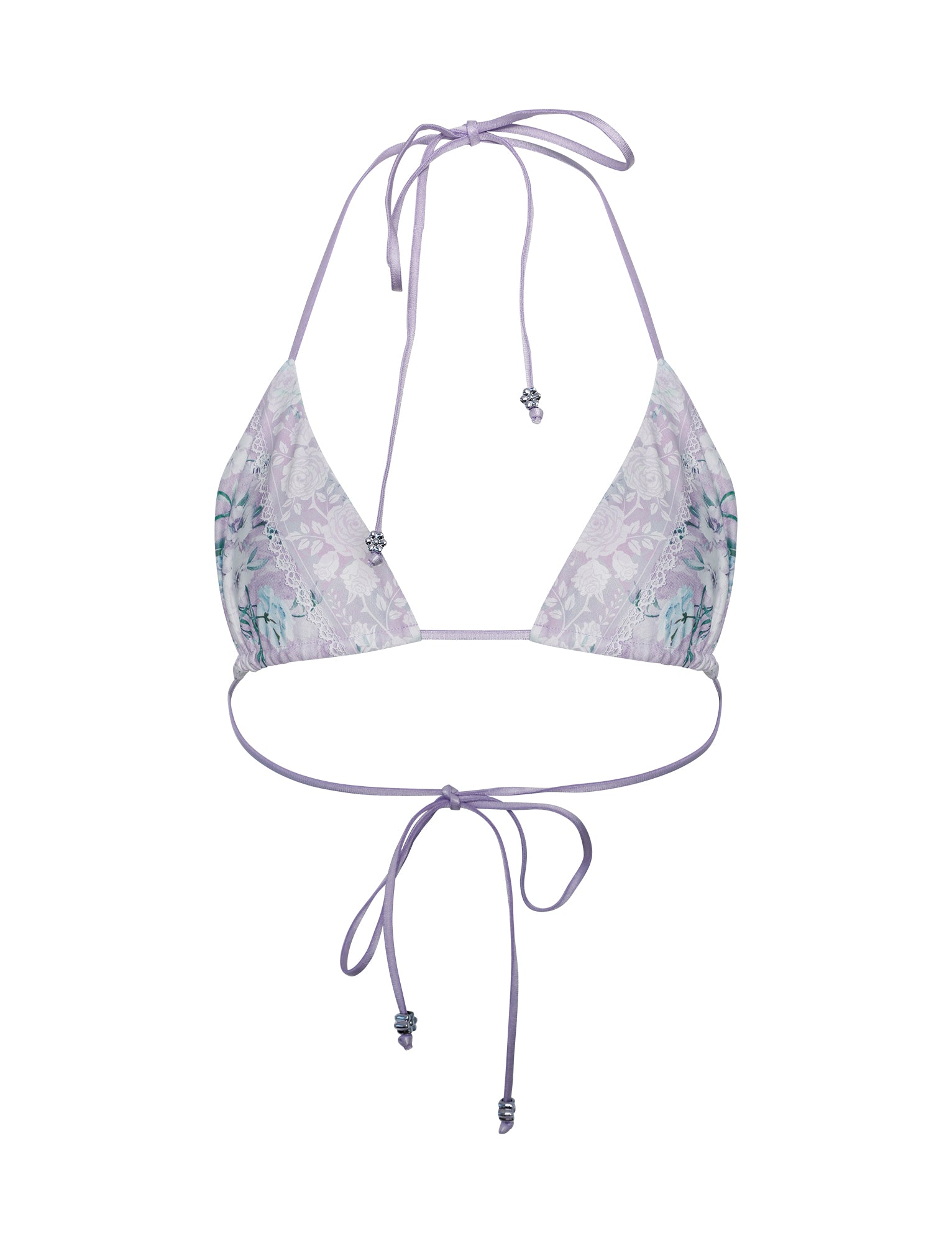 The AVE Bikini Top - Purple : Floral Boarders from TIGERMIST showcases a lavender hue with an intricate textured floral pattern. It features thin straps that tie behind the neck and back, adorned with small beaded accents at the ends of the ties. The fabric has a subtle sheen that enhances the floral detailing.