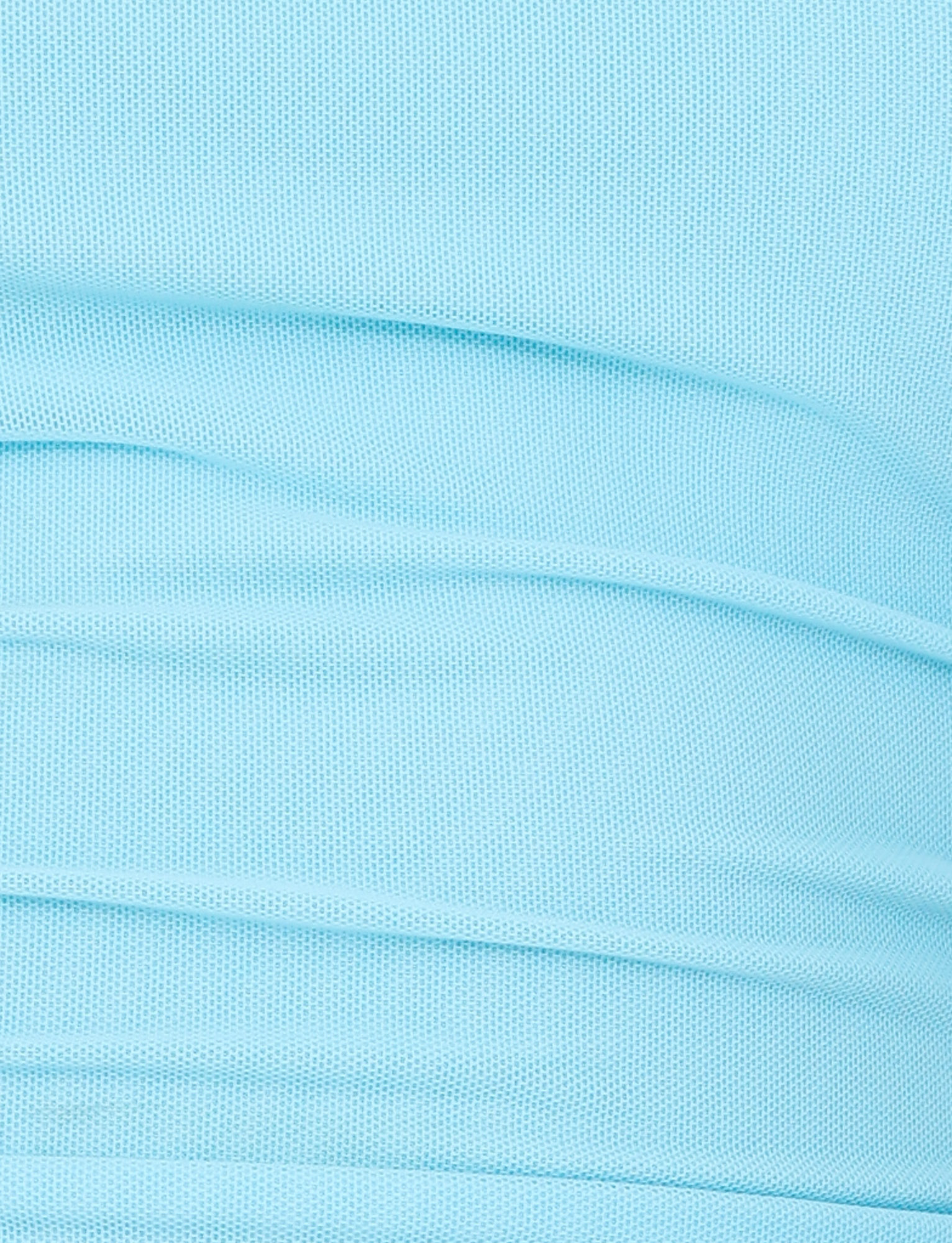 Close-up of light blue, high-stretch mesh with visible texture and folds, creating a softly layered look reminiscent of the HARRIETT TUBE TOP in ICE BLUE by TIGERMIST.
