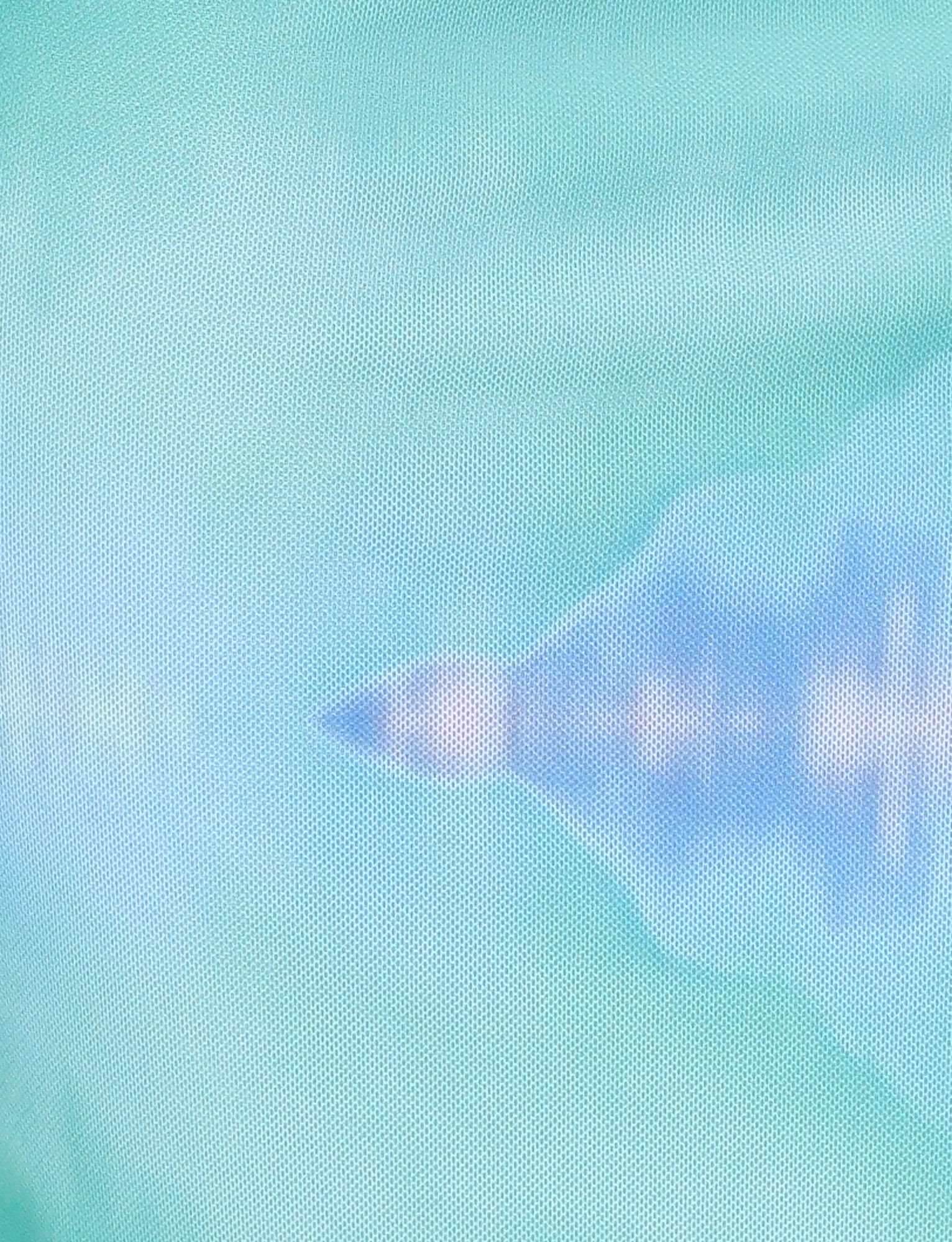 A shadowy silhouette of a jet appears behind a blue-green mesh, evoking the exclusive, abstract print of the TIGERMIST ARDON MAXI DRESS - BLUE : MACRO FLORAL : BLUE HIBISCUS.