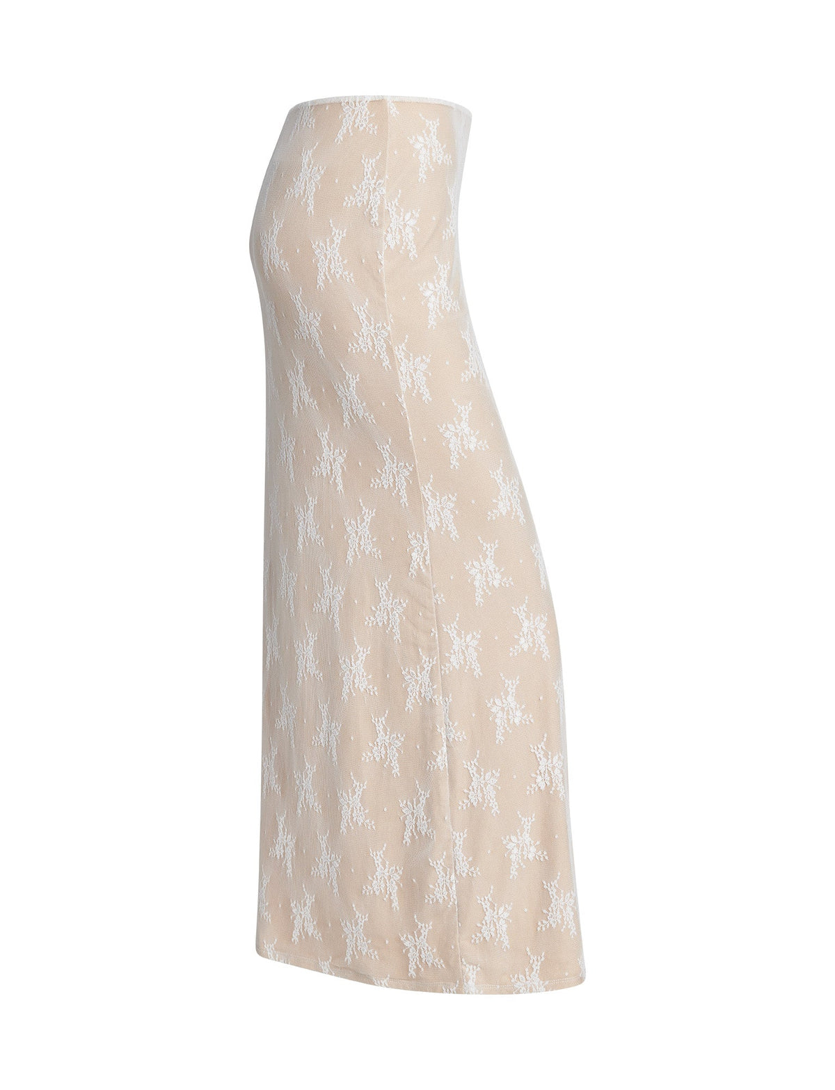Side view of the KAROLINA SKIRT from TIGERMIST, featuring a beige, knee-length design adorned with a white floral pattern. The skirt offers a fitted silhouette with a slight flare towards the bottom and is constructed from lightweight, textured material for comfort and breathability.