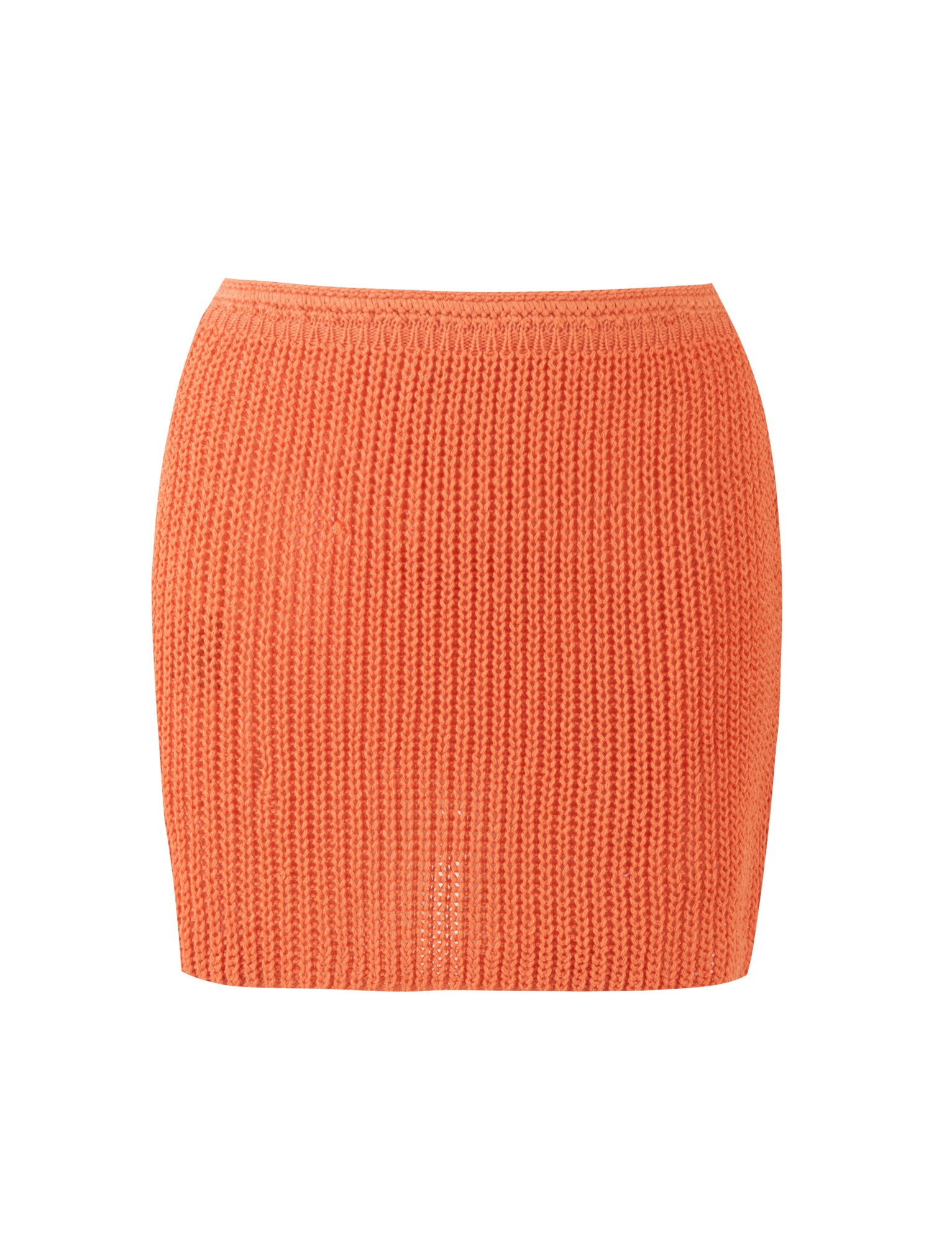 This image displays the TIGERMIST MACAULEY MINI SKIRT in bright orange. The knit skirt features a ribbed texture and a form-fitting design, complete with a seamless waistband. The material looks soft and lightweight, making it perfect for casual or semi-casual occasions. It is designed without any visible zippers or buttons.