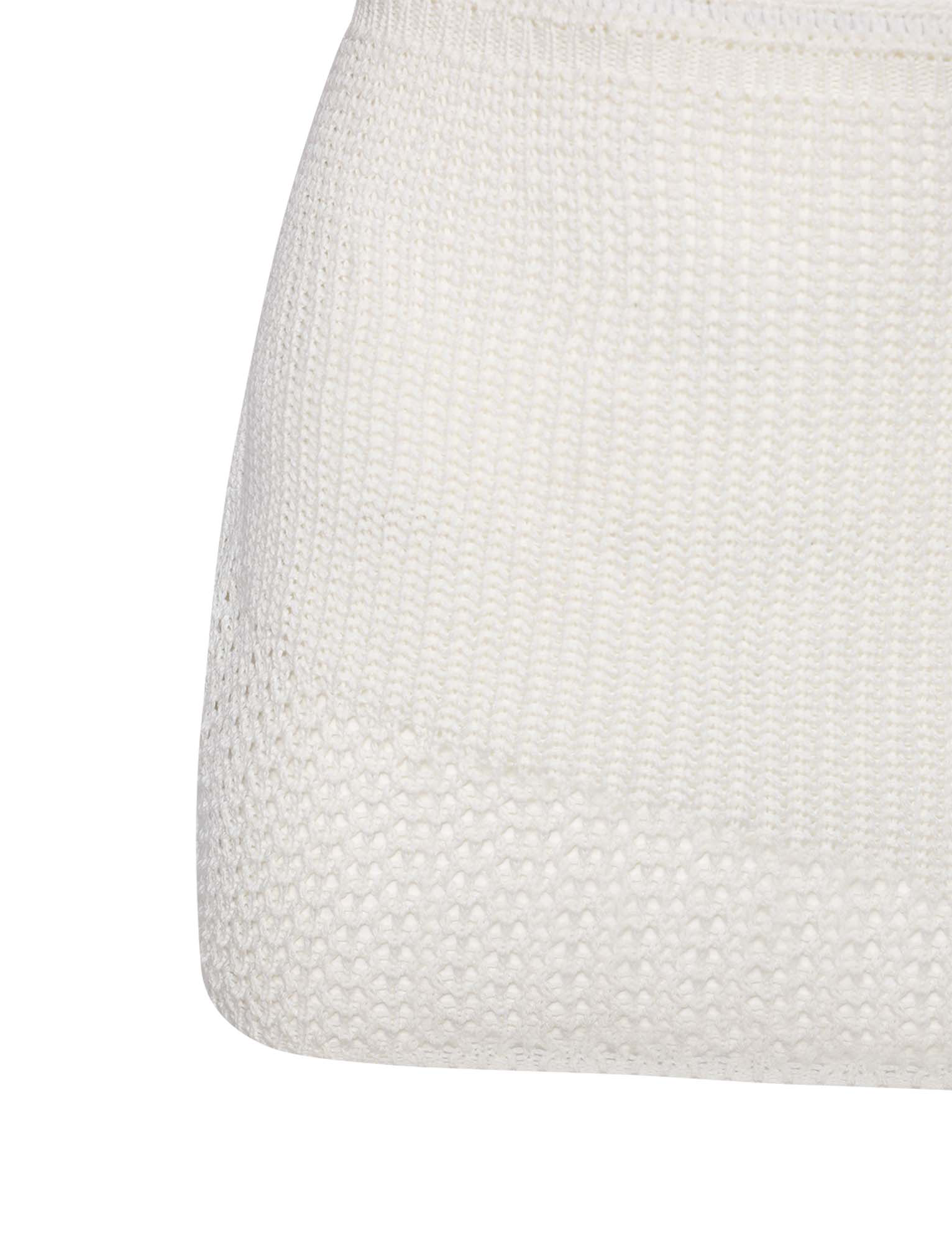 Close-up of the TIGERMIST MACAULEY MINI SKIRT - WHITE, highlighting its textured knit pattern and sleek bodycon fit, perfect for a stylish, modern look.