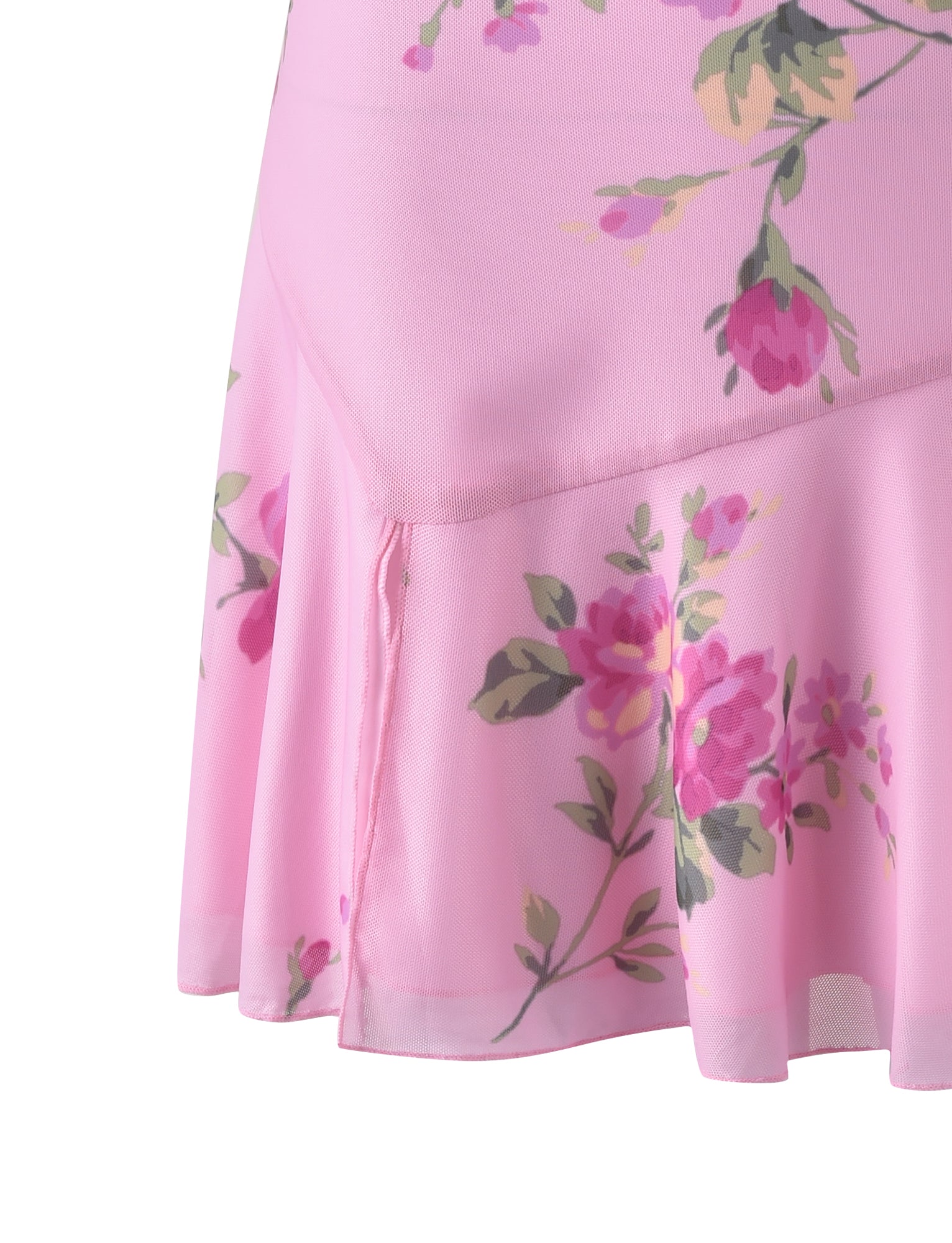 Close-up of the light pink FEYRA SKIRT - PINK : MACRO FLORAL by TIGERMIST, featuring a floral pattern with pink and purple flowers alongside green leaves. The skirt has a ruffled, flowing hemline and appears to be made of soft fabric, with the floral design scattered across the material.