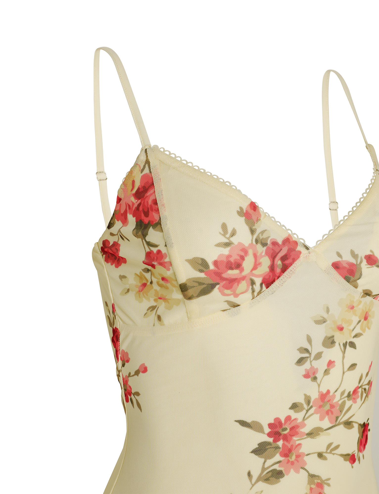 A close-up of the TIGERMIST JULIANNA DRESS in yellow, featuring a macro pop floral pattern with pink and red flowers, green leaves, and adjustable spaghetti straps. The material appears soft and slightly sheer.