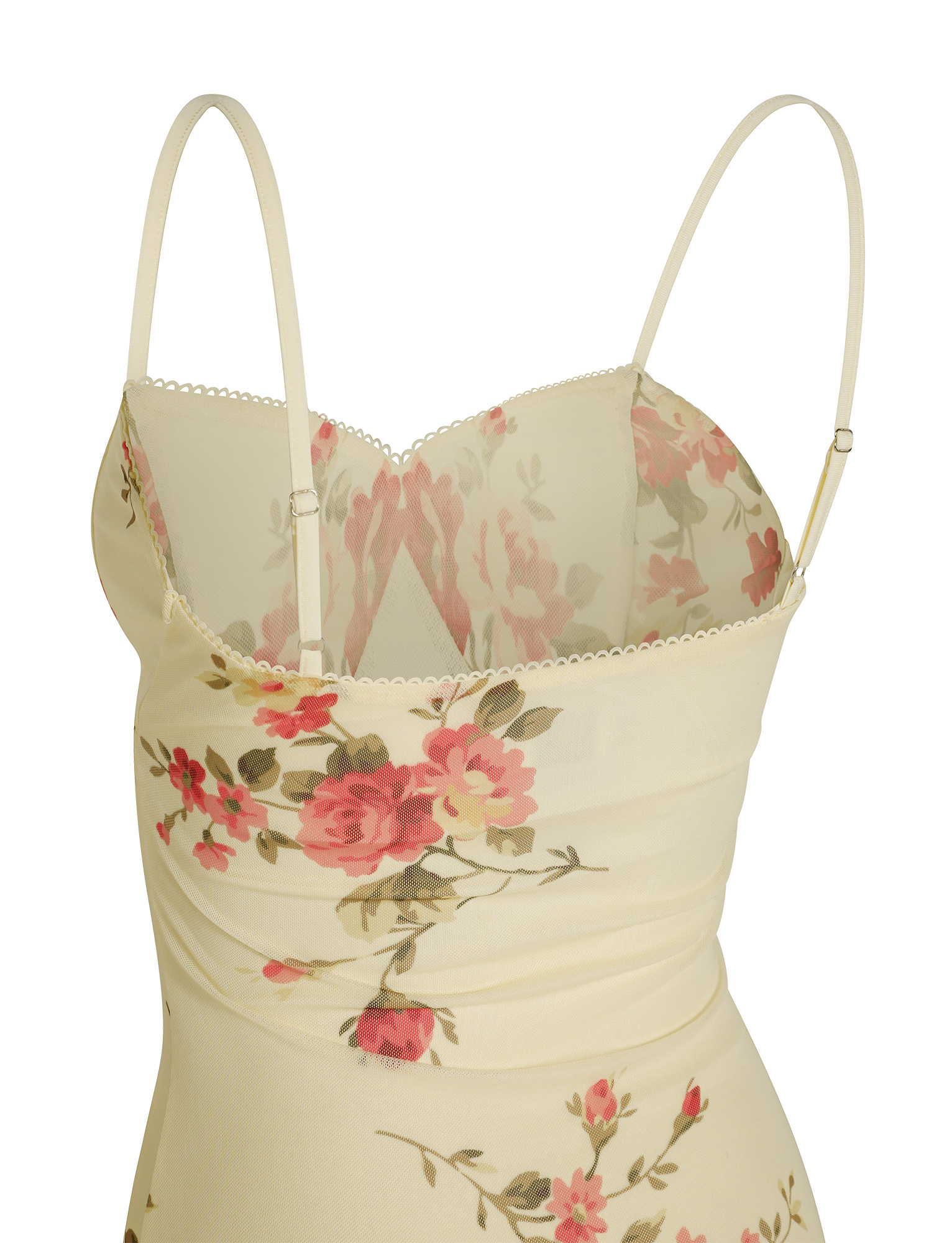 A close-up of the TIGERMIST JULIANNA DRESS in yellow macro floral, featuring pink and red roses, green leaves, adjustable spaghetti straps, sheer mesh top, and delicate scalloped trim along the neckline.