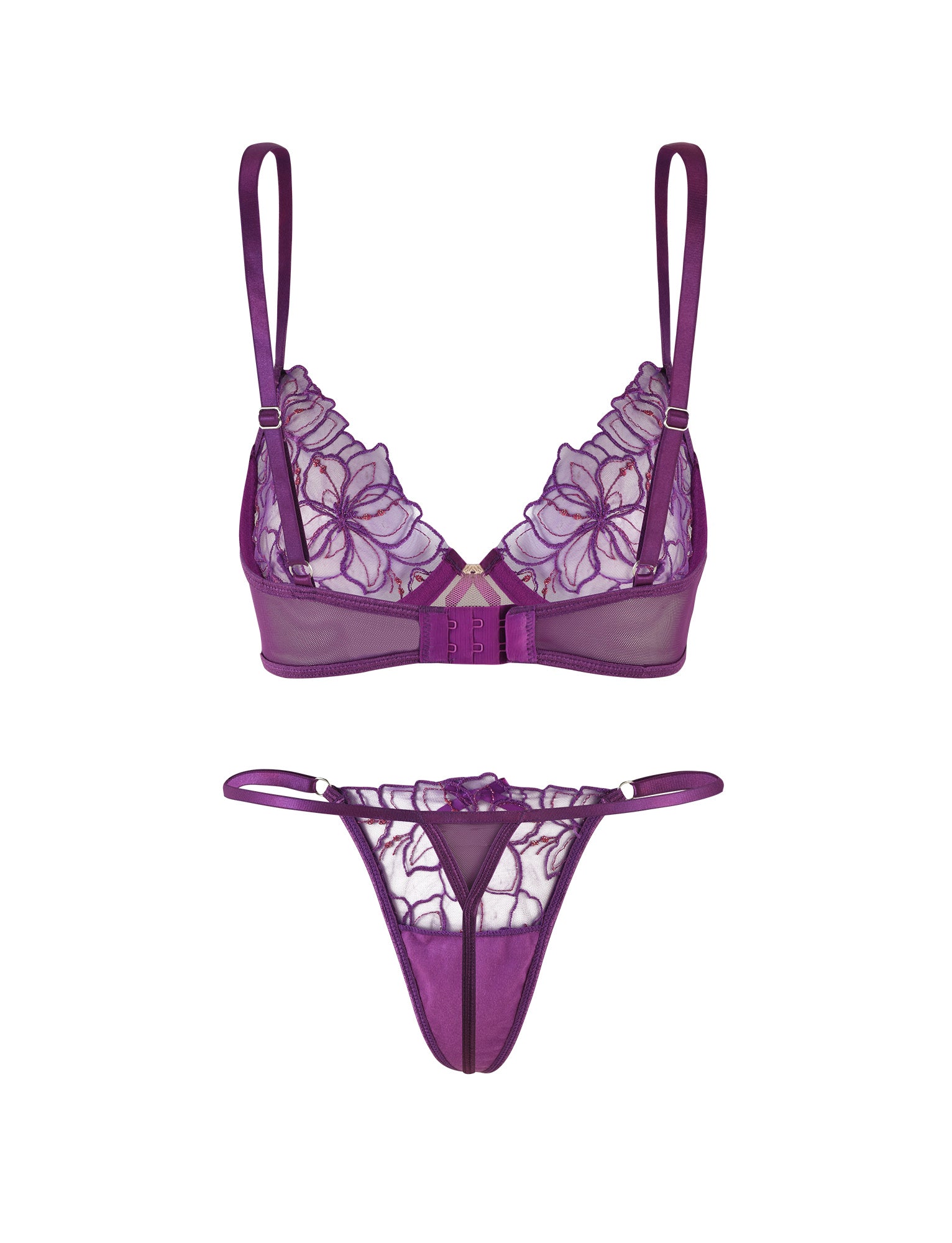 The LAURA SET - PURPLE: LAVENDER by TIGERMIST includes a sheer bralette with floral lurex lace detailing, a front clasp, and adjustable shoulder straps, complemented by a thong with matching lace accents and thin waistband straps.