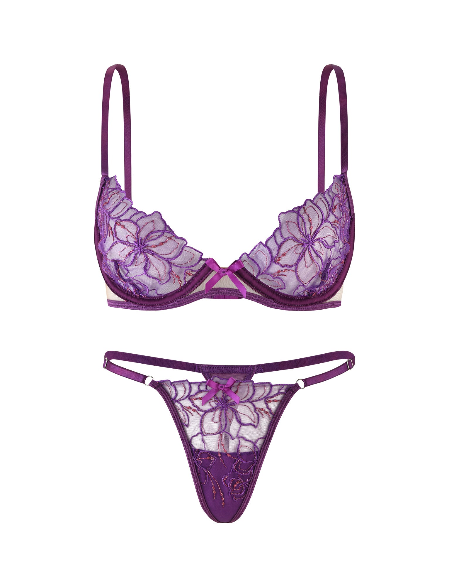 The LAURA SET - PURPLE : LAVENDER by TIGERMIST features a lace bra adorned with floral embroidery and delicate, adjustable shoulder straps, paired with matching lace panties showcasing similar floral patterns and thin side straps. The set is displayed against a white background.