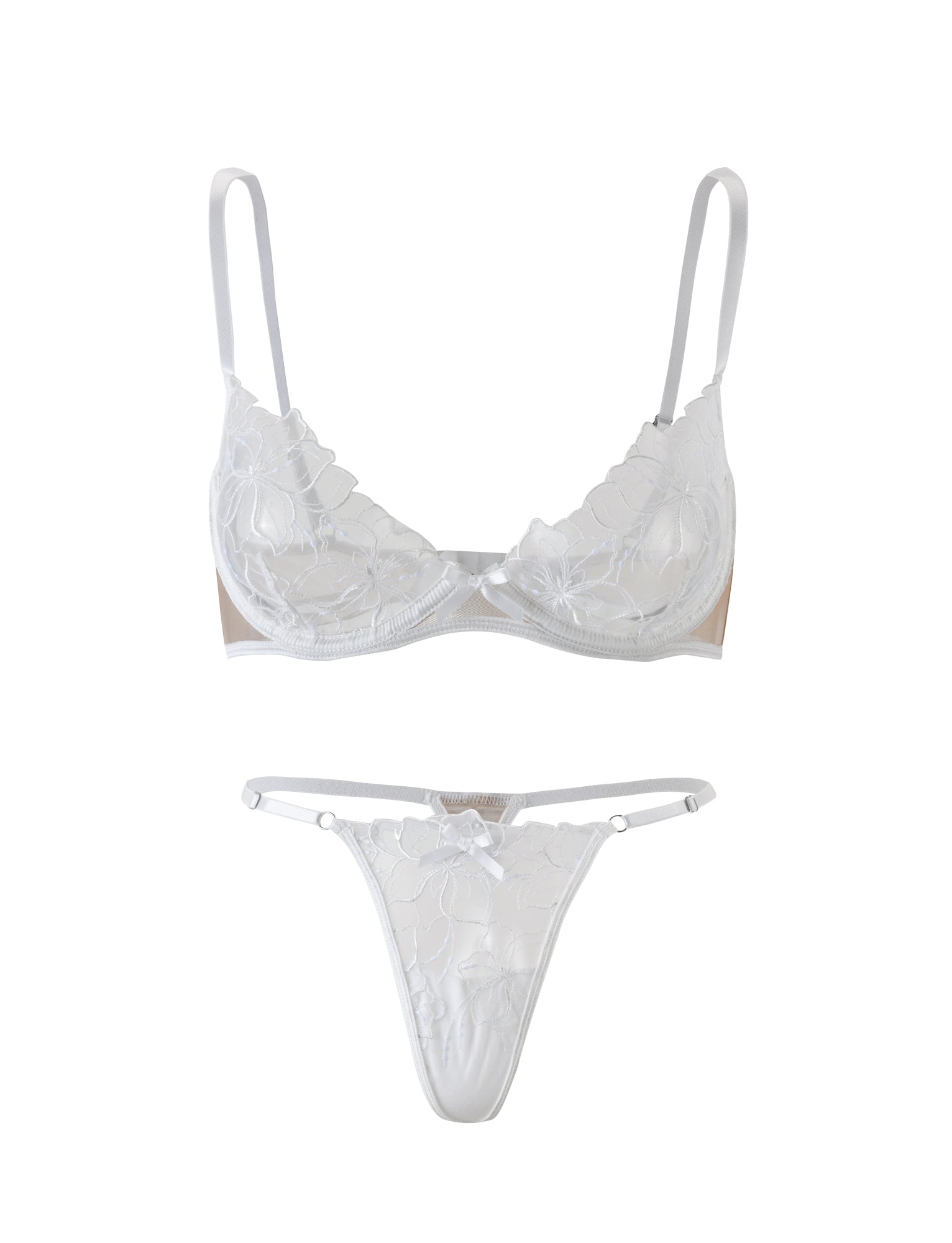 The LAURA SET - WHITE by TIGERMIST is a white lace lingerie set that includes a bra with adjustable thin straps and intricate floral lace detailing, paired with a matching thong featuring the same floral lace design and delicate bow accents. The set is displayed against a plain white background.