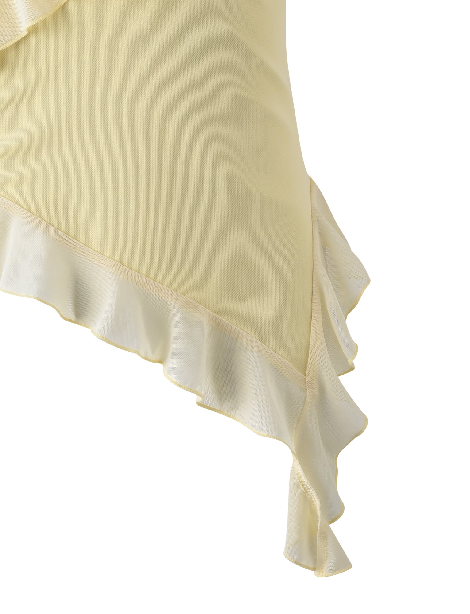 Close-up of the light yellow STORMI TOP - YELLOW : LEMON fabric by TIGERMIST with ruffled edges. The material appears soft and has a gentle flow. The image focuses on the details of the ruffles, highlighting their delicate and elegant construction.