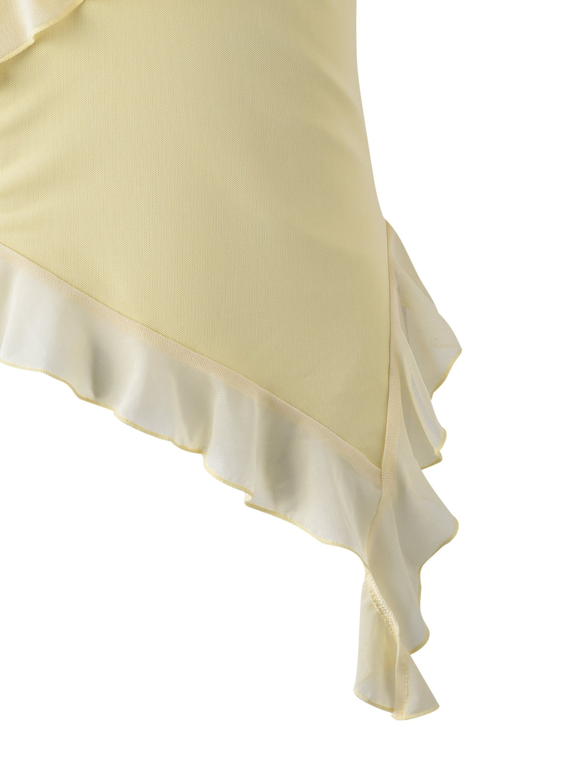 Close-up of the light yellow STORMI TOP - YELLOW : LEMON fabric by TIGERMIST with ruffled edges. The material appears soft and has a gentle flow. The image focuses on the details of the ruffles, highlighting their delicate and elegant construction.