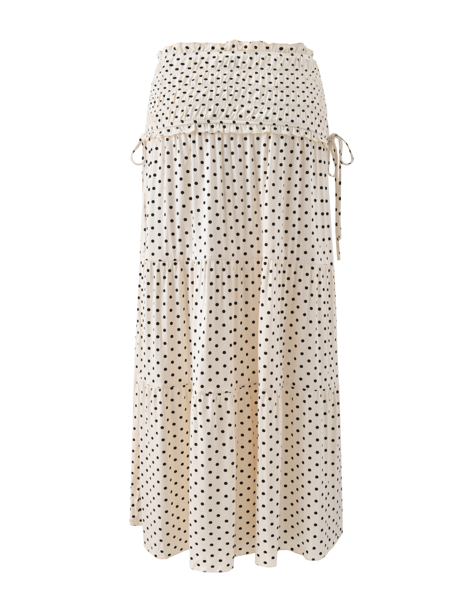 The TIGERMIST DENALI MAXI SKIRT - CREAM DOT features a soft modal fabric, smocked waistband, tiered design, and adjustable side ties, shown on a plain white background.