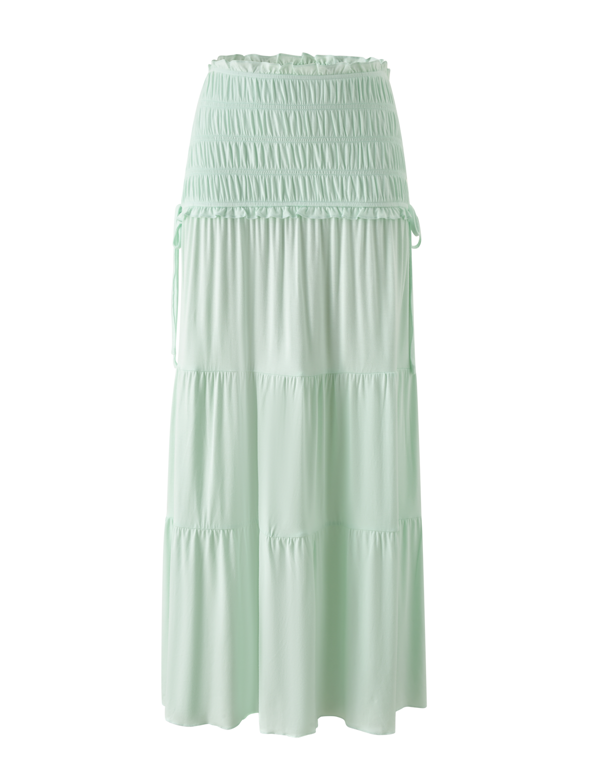 The TIGERMIST DENALI MAXI SKIRT in Soft Mint features a shirred waistband, adjustable side ties, and tiered layers. Crafted from soft modal fabric, this relaxed maxi skirt offers effortless and casual style.