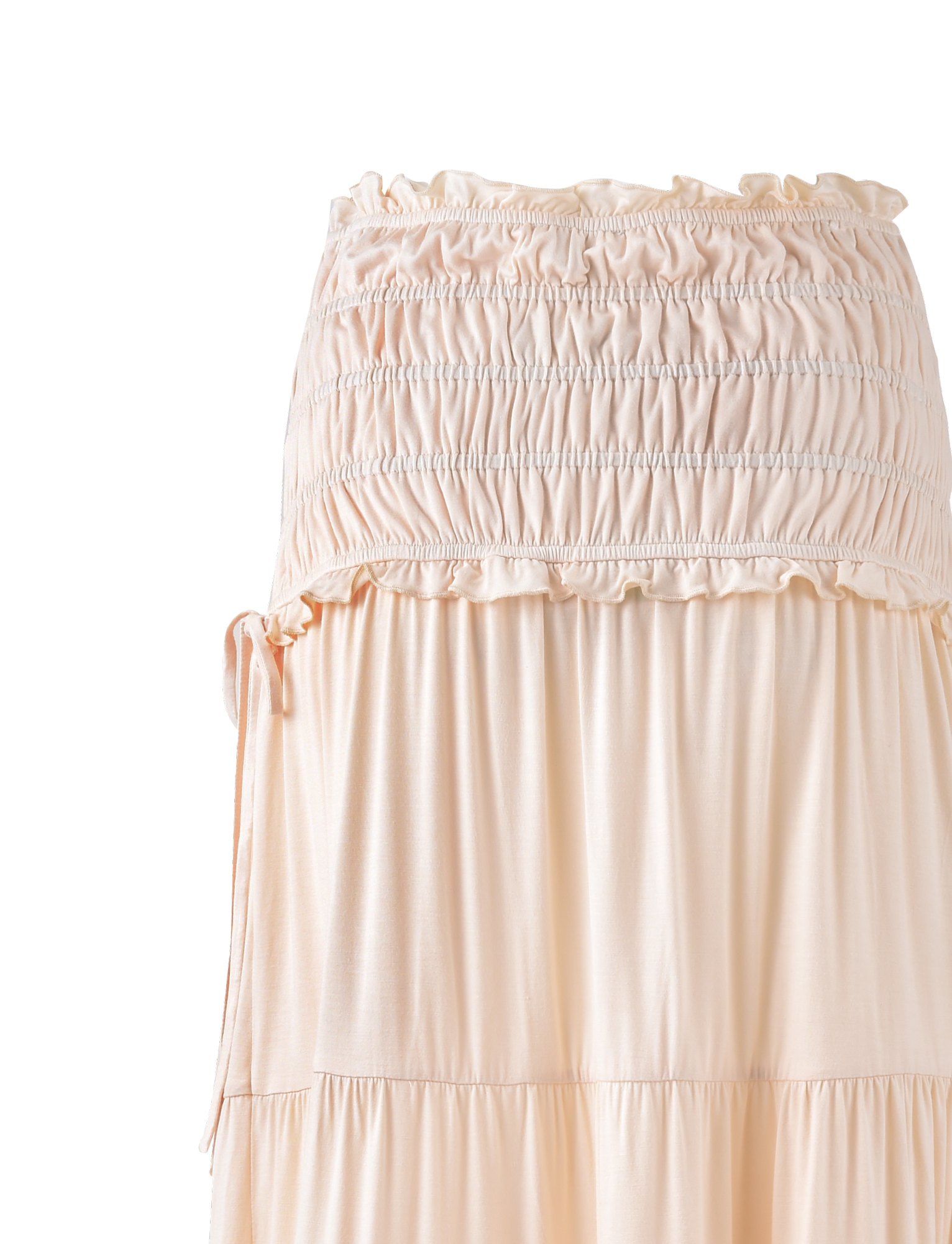 The DENALI MAXI SKIRT - NEUTRAL: BONE by TIGERMIST is a light beige, high-waisted maxi skirt with a ruched, elastic waistband and tiered, flowing design in soft jersey. The flared silhouette appears slightly sheer at the top.