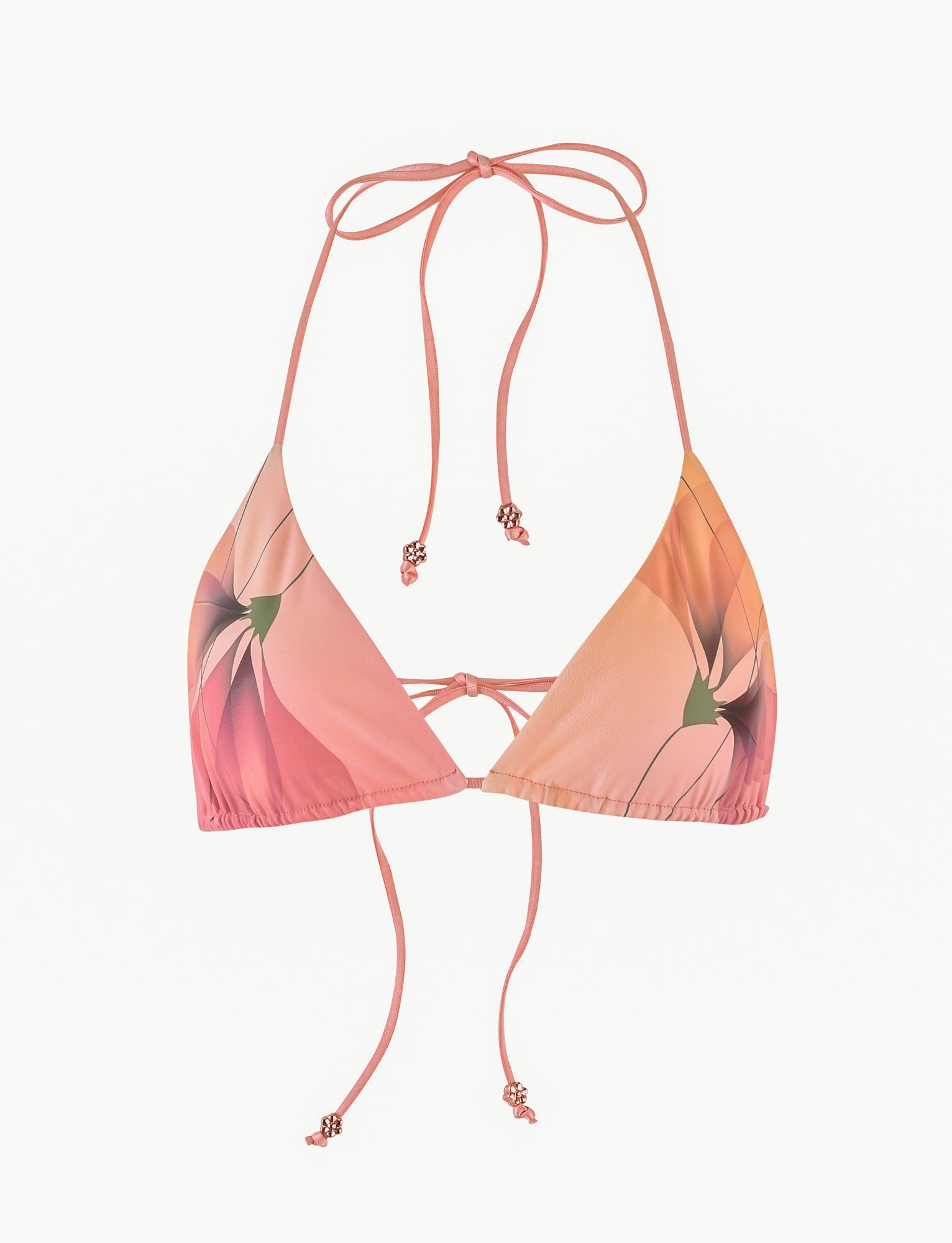 The AVE Bikini Top from TIGERMIST boasts a pink triangle design with a macro floral print. It features adjustable string ties at the neck and back, accented by small decorative beads. The floral pattern displays soft pink and orange hues with green accents.