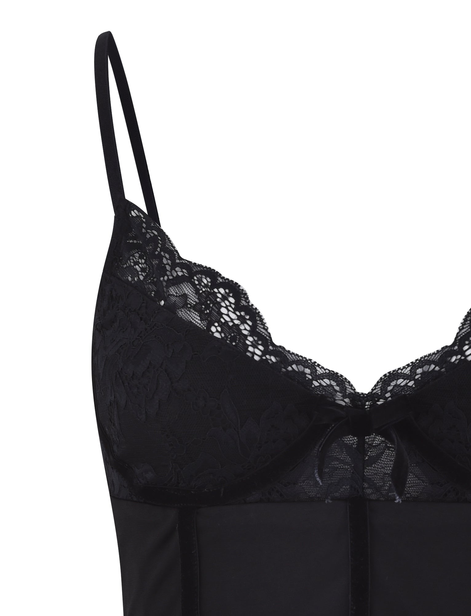 Close-up of the MORENA TOP - BLACK from TIGERMIST, showcasing the upper portion adorned with intricate lace detailing along the neckline, thin shoulder straps, and a small bow in the center. The fabric below the lace has a smooth and elegant finish.