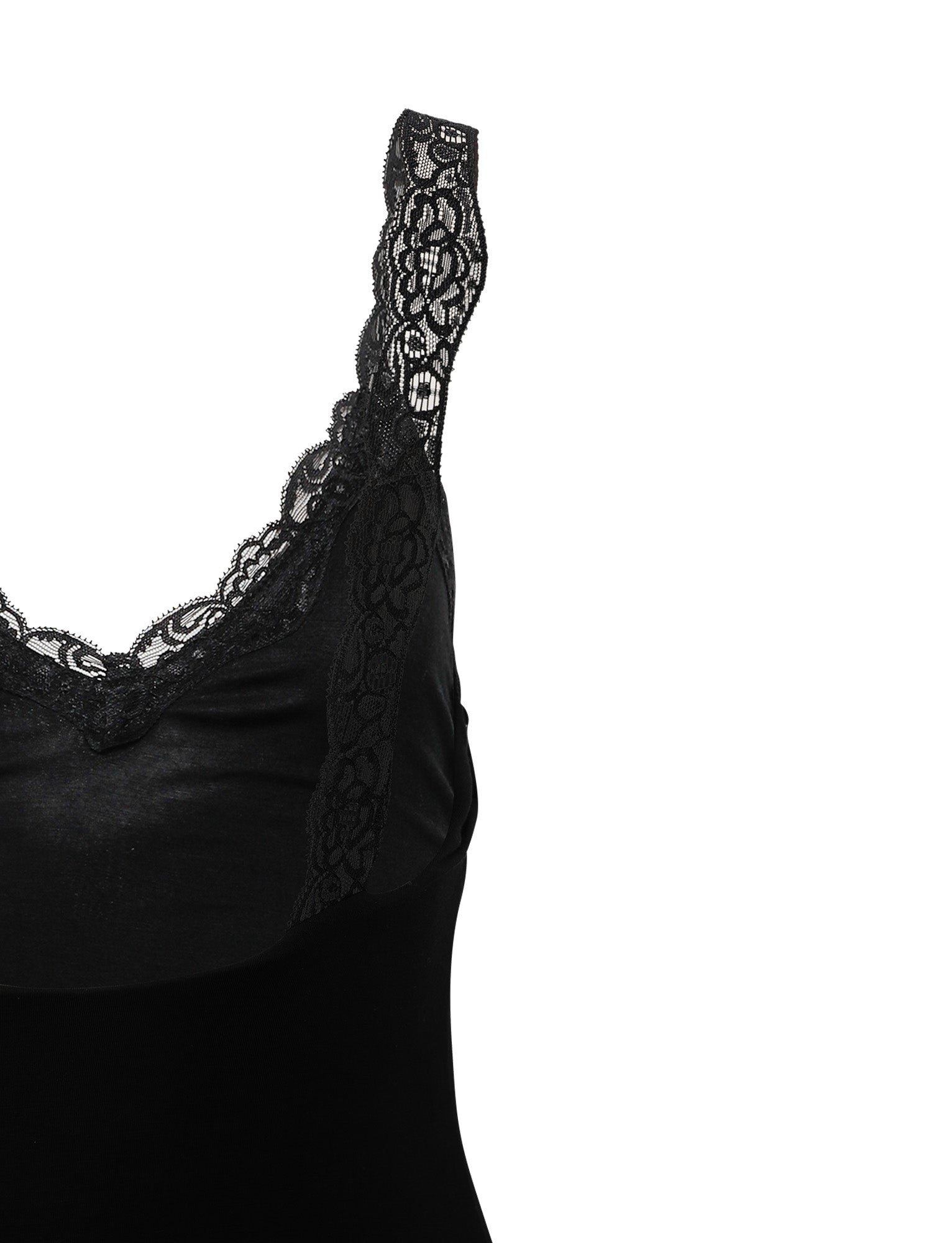 A close-up of the Kacie Dress - Black by Tigermist featuring intricate lace detailing. The lace adorns the neckline and straps, adding an elegant touch to the design. Set against a plain white background, this highlights both the intricacies of the lace and the sleekness of the dress.