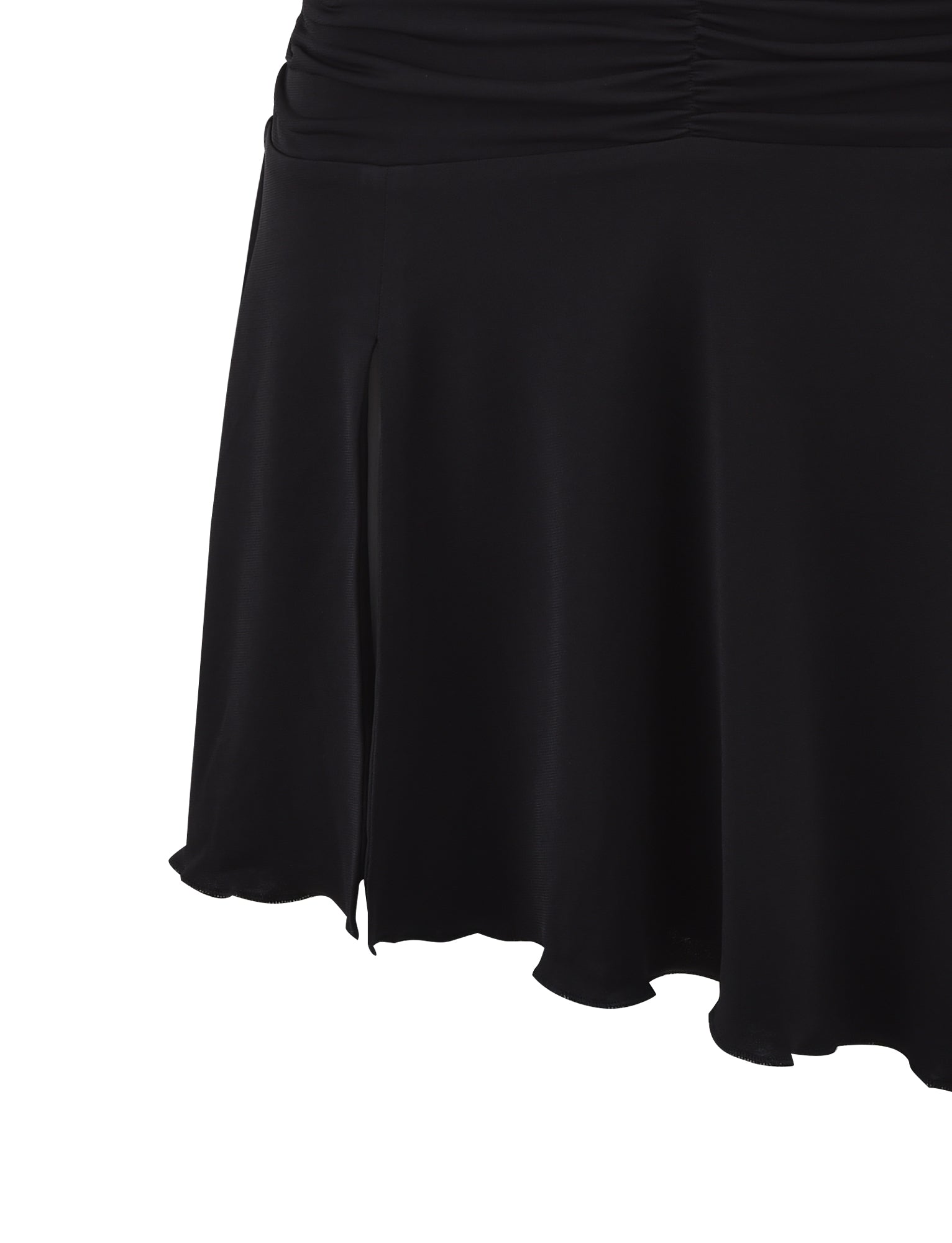 Close-up of the lower part of a black Tigermist Myra Dress. The dress appears to be made of a smooth, flowing fabric and features a small slit on the side along with subtle gathering at the waist. The hem is slightly wavy, giving a graceful and elegant look.