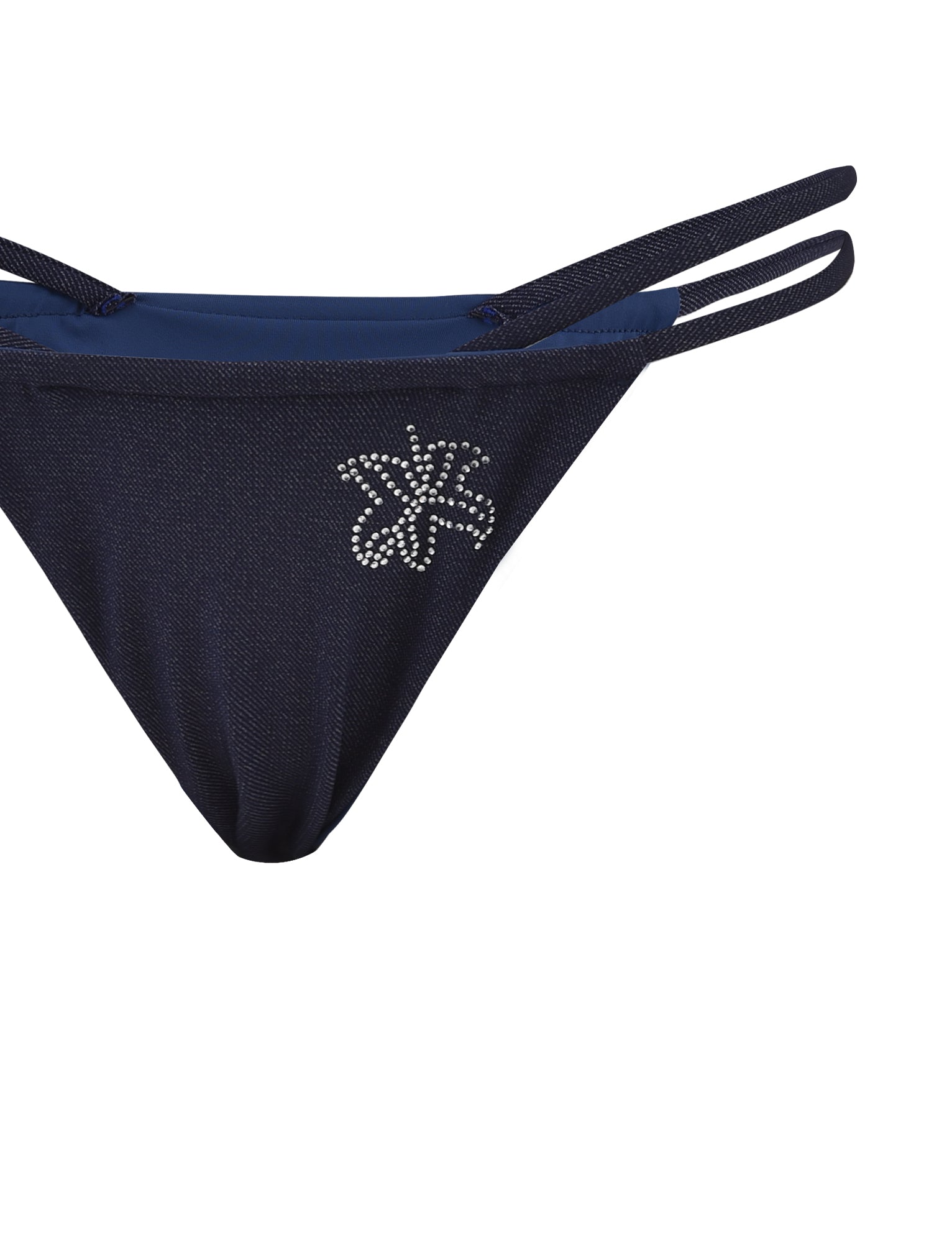 A close-up image of the CALISTA BIKINI BOTTOM - BLUE : DARK DENIM from TIGERMIST, showcasing its double side straps. The navy blue fabric is adorned with a small, decorative silver leaf design made of rhinestones on the front left side. The background is plain white.