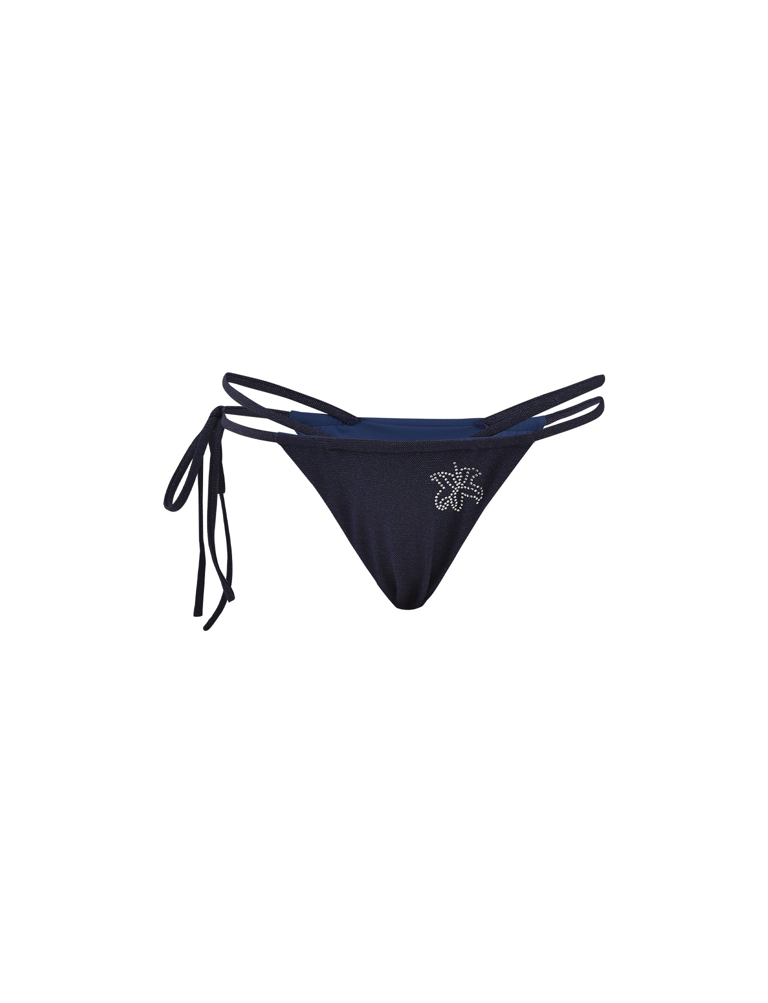 The CALISTA BIKINI BOTTOM - BLUE : DARK DENIM from TIGERMIST features two thin side straps on each side, with one tying into a bow on the left. The front is adorned with a small decorative starfish pattern made of shiny studs.