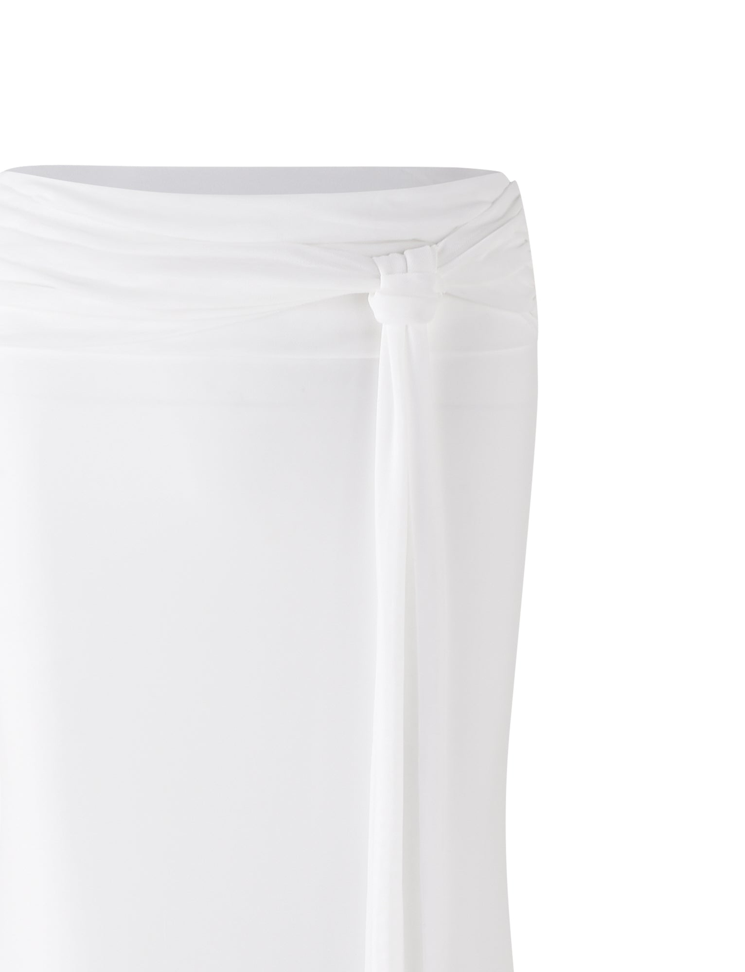 A close-up of the white fabric from the TIGERMIST MIST SKIRT, featuring a knot tied at the waist. The soft and lightweight material drapes smoothly from the knot, set against a plain white background to highlight both the fabric and detailed knot.
