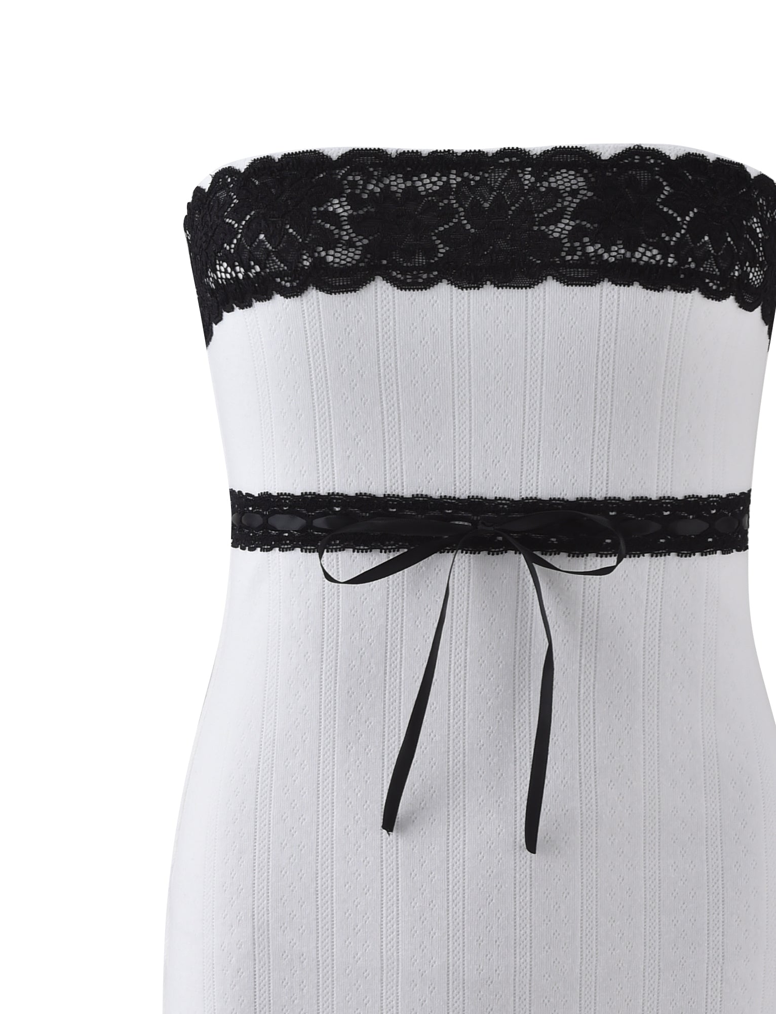 The MARCIA MINI DRESS - WHITE from TIGERMIST is a white strapless dress adorned with black lace trim at the top and a black lace band around the waist, elegantly tied in a bow at the front.