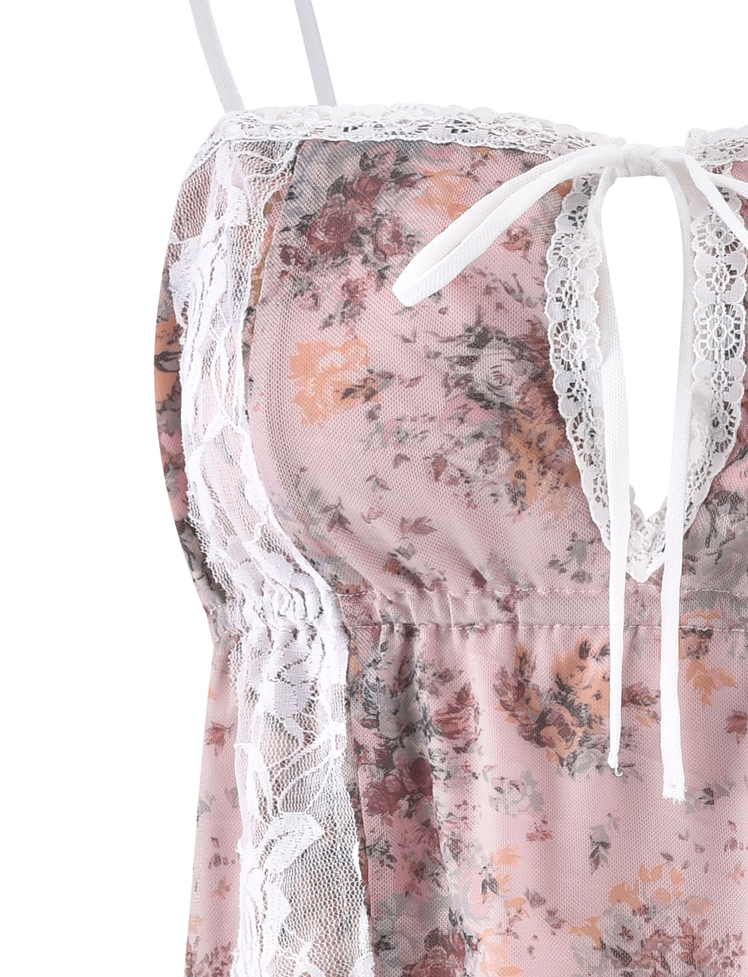 Close-up image of TIGERMIST's LEYSA TOP - PINK : CAMO FLORAL detail. The light pink camisole with a floral print features delicate white lace along the neckline and straps, while a bow tie at the center of the neckline adds a feminine touch.