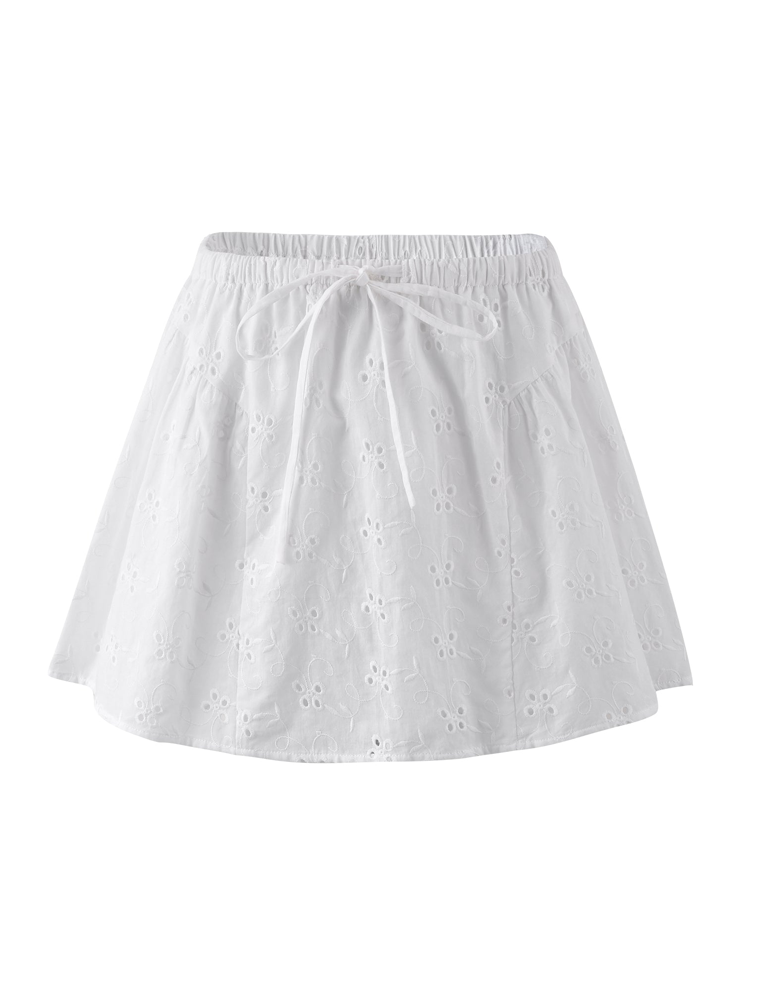 The KAYLEIGH SKIRT - WHITE by TIGERMIST is a white, lightweight skirt with an elastic waistband and an eyelet floral pattern. It features small, delicate perforated flower designs throughout and includes a drawstring for adjusting the fit. The skirt flares out slightly, offering a casual and breezy appearance.