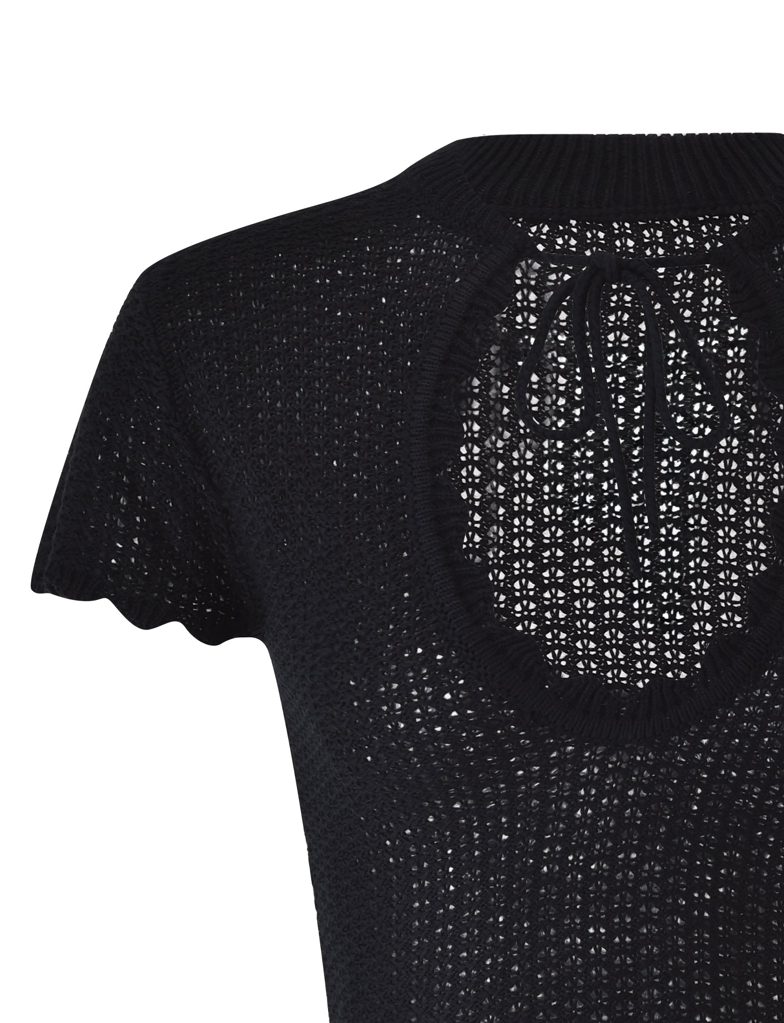 A close-up of the TEREZA TOP - BLACK by TIGERMIST, showcasing its short-sleeved, black knitted design with a round neckline and intricate open-knit pattern. The back features a keyhole opening tied at the neck with a small ribbon.