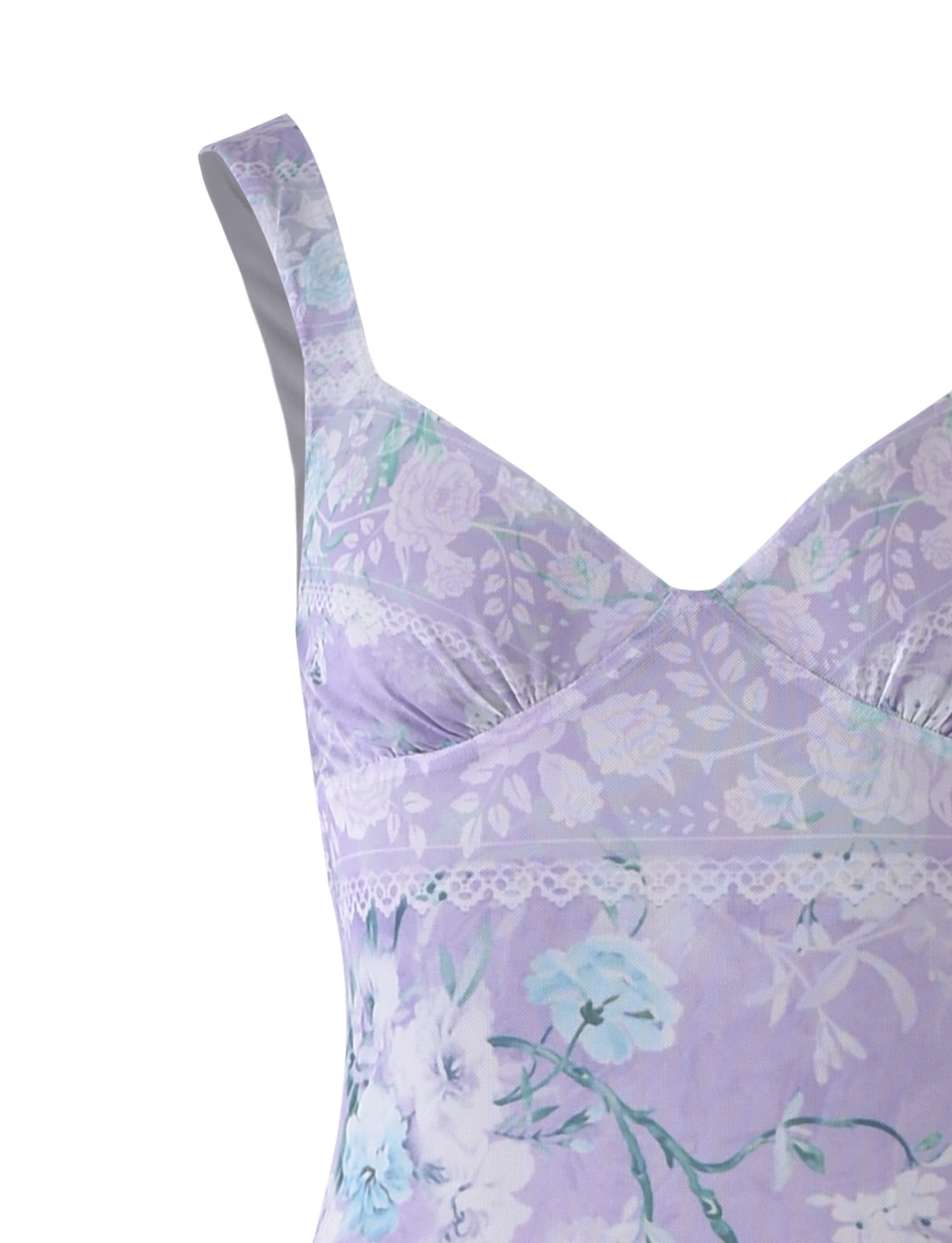 A close-up of the KARMEN DRESS - PURPLE : FLORAL BOARDERS by TIGERMIST, featuring pastel purple fabric adorned with a delicate pattern of white and blue flowers. The dress includes spaghetti straps and lace trim along the neckline and underbust.