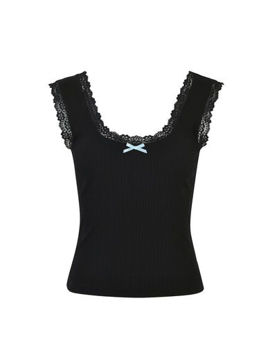The SABINE TOP - BLACK from TIGERMIST is a black sleeveless top with delicate lace trim around the neckline and armholes. A small, light blue ribbon bow adorns the center of the neckline, while the fabric boasts a subtle ribbed texture.
