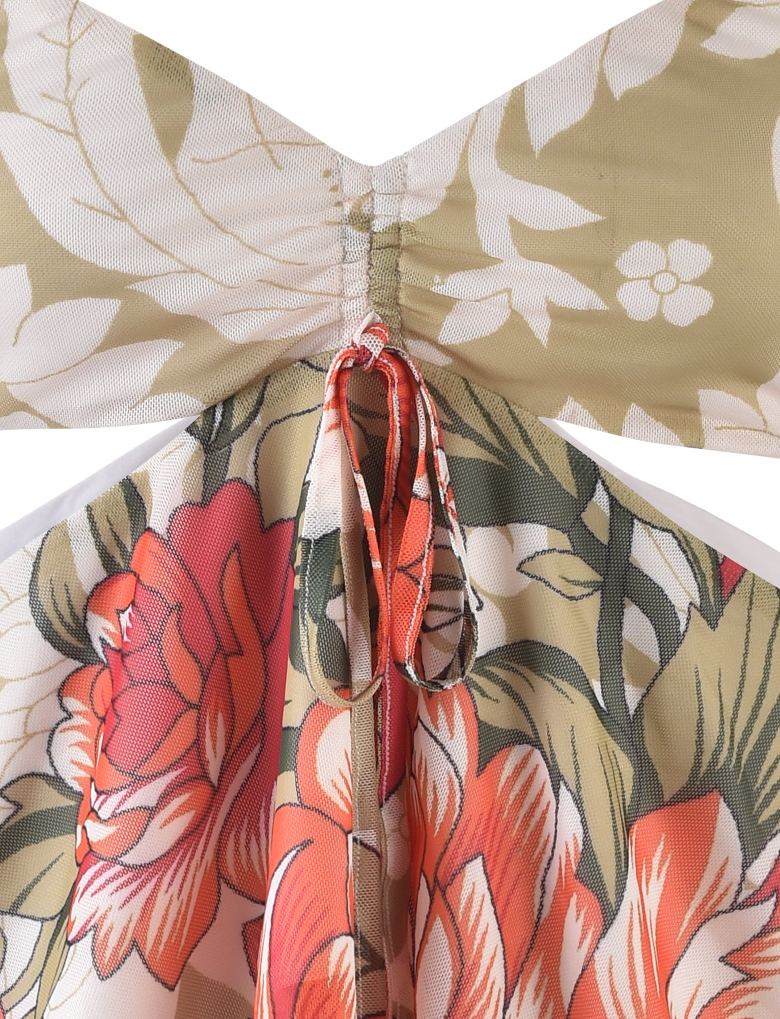 Close-up of the RIOT TOP - MULTI : MACRO FLORAL : SUNSET BLOOMS from TIGERMIST, showcasing vibrant orange and white flowers against a green and white leafy background. The fabric is gathered and stitched in the center, creating a bow-like appearance with ties hanging down.