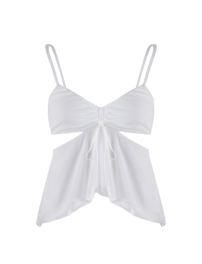 The RIOT TOP - WHITE from TIGERMIST is a white sleeveless top with thin shoulder straps and a stylish front-tie detail under the bust. It features a cut-out design beneath the bust and leads to a flowy, asymmetrical hem, made from lightweight and airy fabric.