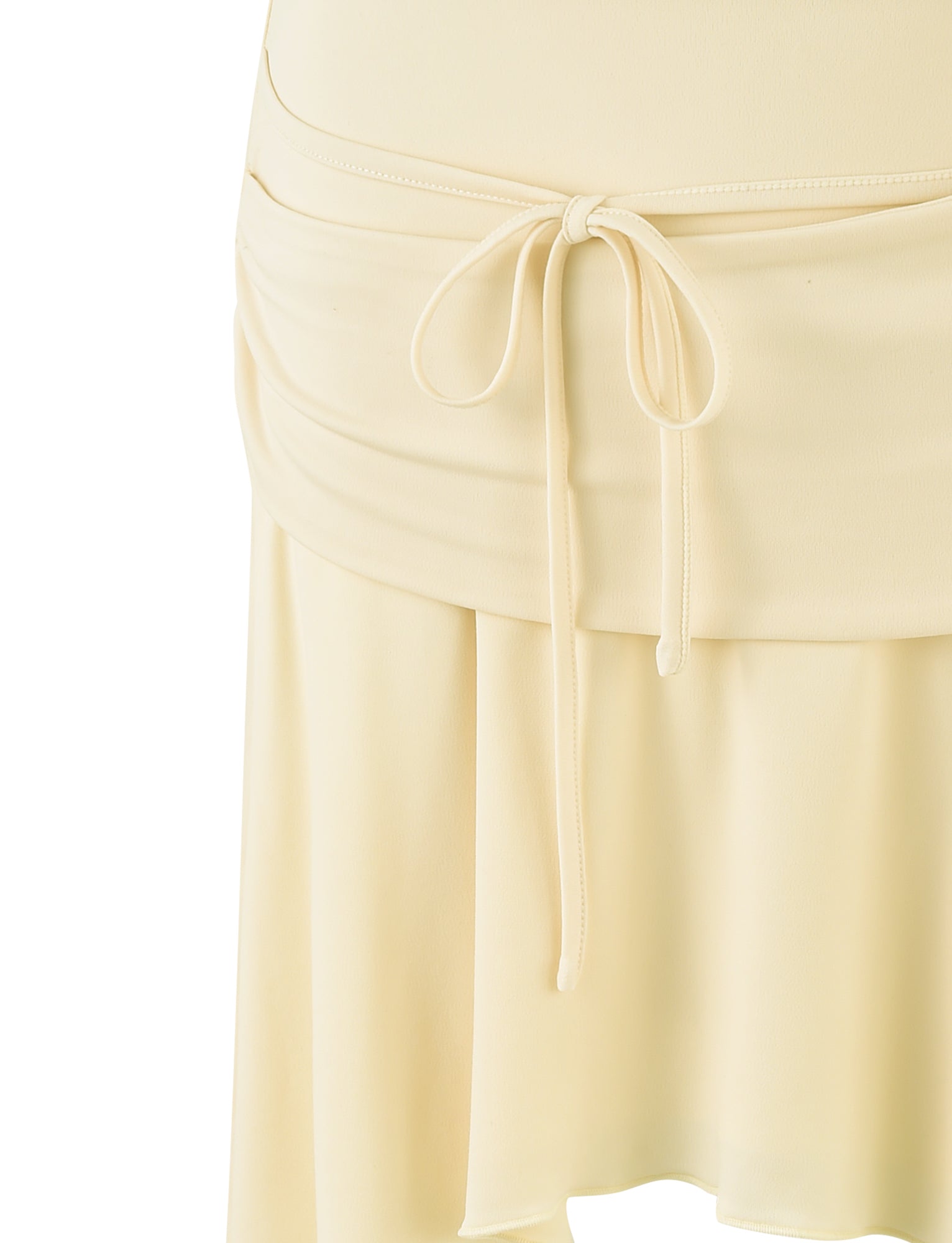 Close-up of the PEARL SKIRT in PALE LEMON by TIGERMIST, featuring a drawstring waistband with tied straps at the front. The skirt has a soft, slightly pleated design, giving it a flowy appearance. The fabric appears to be lightweight and smooth.