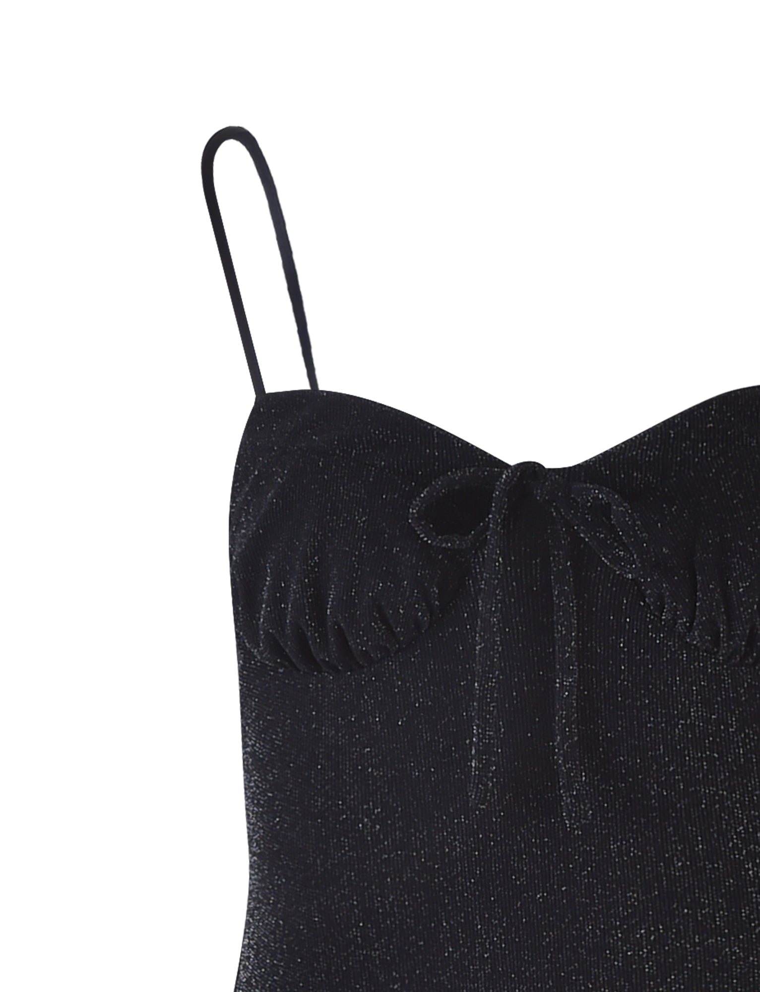 A close-up of the Black Shimmer Catya Dress by TigerMist. The dress showcases spaghetti straps and features ruched detailing just below the neckline, accented with a small bow tied at the center. The fabric has a slight glittery effect, giving it a sparkly look.