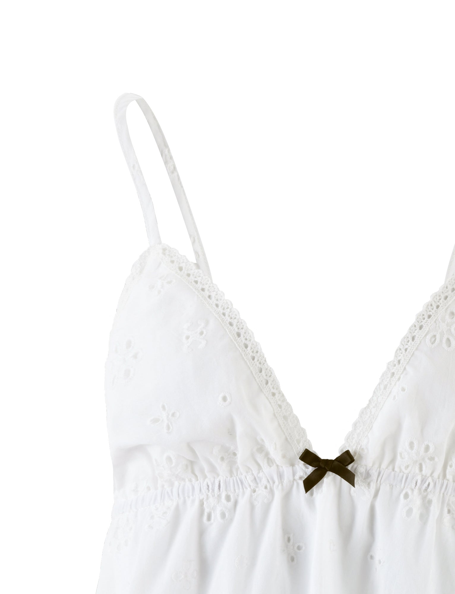 A stunning piece from TIGERMIST, the MILANI TOP - WHITE is a white lace camisole with thin shoulder straps, a deep V-neckline, and exquisite floral embroidery. The lace features delicate eyelet designs and is adorned with a small black bow at the center front beneath the bust.