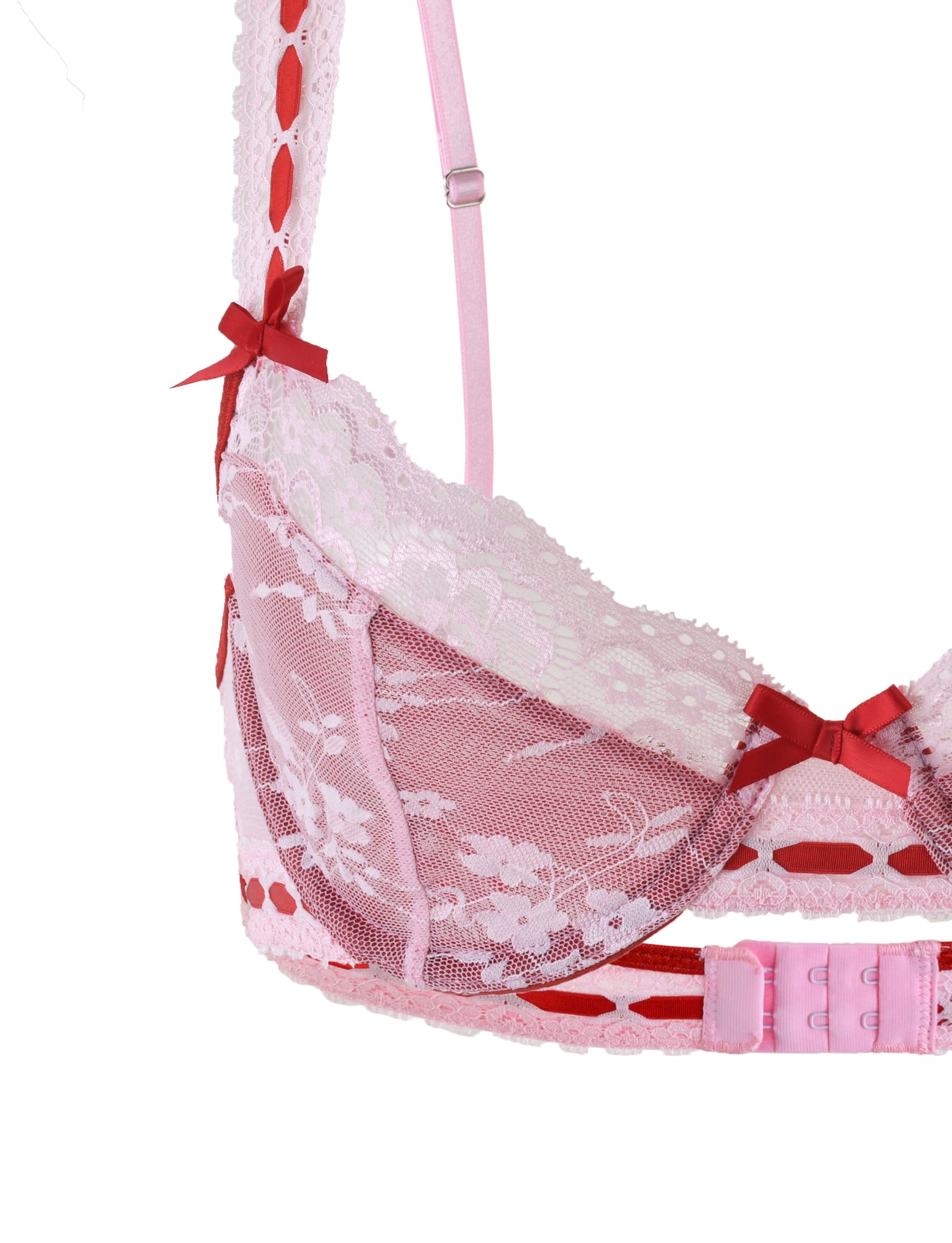 Close-up of the Tiger Mist "Lavina Set - Red: Salsa" bra, featuring an intricate pink lace floral pattern and red satin bows adorning the straps. The semi-transparent design includes adjustable pink straps and a multi-hook closure at the back. The bra is showcased on a white background.