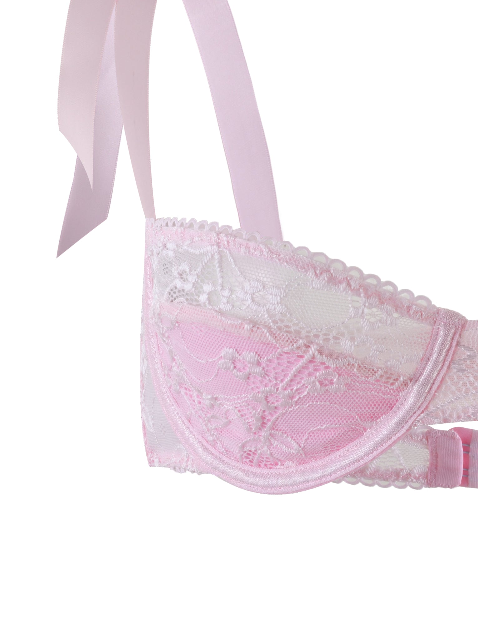 Close-up of the pastel pink Sugar Set bra from TIGERMIST, showcasing intricate floral lace patterns and scalloped edges. The bra features a ribbon strap detail at the top, adding to its feminine and elegant appearance.