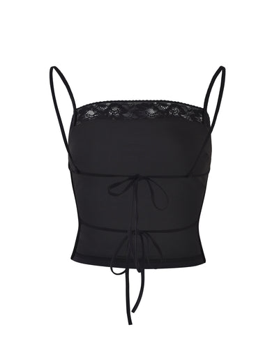 The JAIDA TOP - BLACK from TIGERMIST is a black, spaghetti-strap crop top featuring a lace-trimmed neckline and ribbon ties at the bust and waist. This top showcases sheer fabric and decorative stitching for a delicate, stylish look.