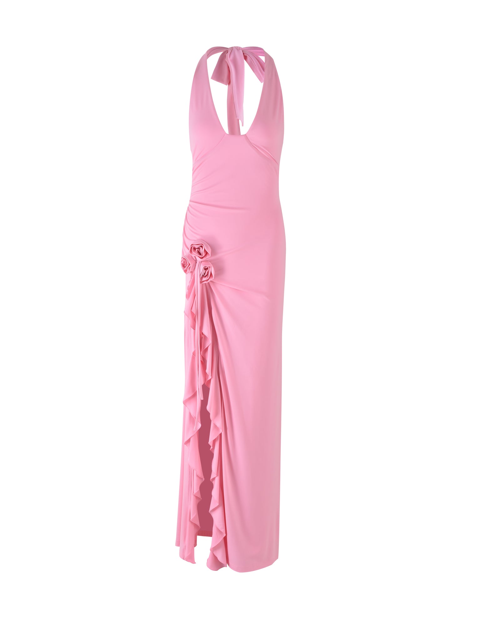 The FAORA DRESS - PINK from TIGERMIST is a long, sleeveless, light pink halter-neck dress featuring a tie at the neck. It has gathered fabric at the waist adorned with rose-like embellishments and includes a ruffled side slit running from the waist down to the hem.