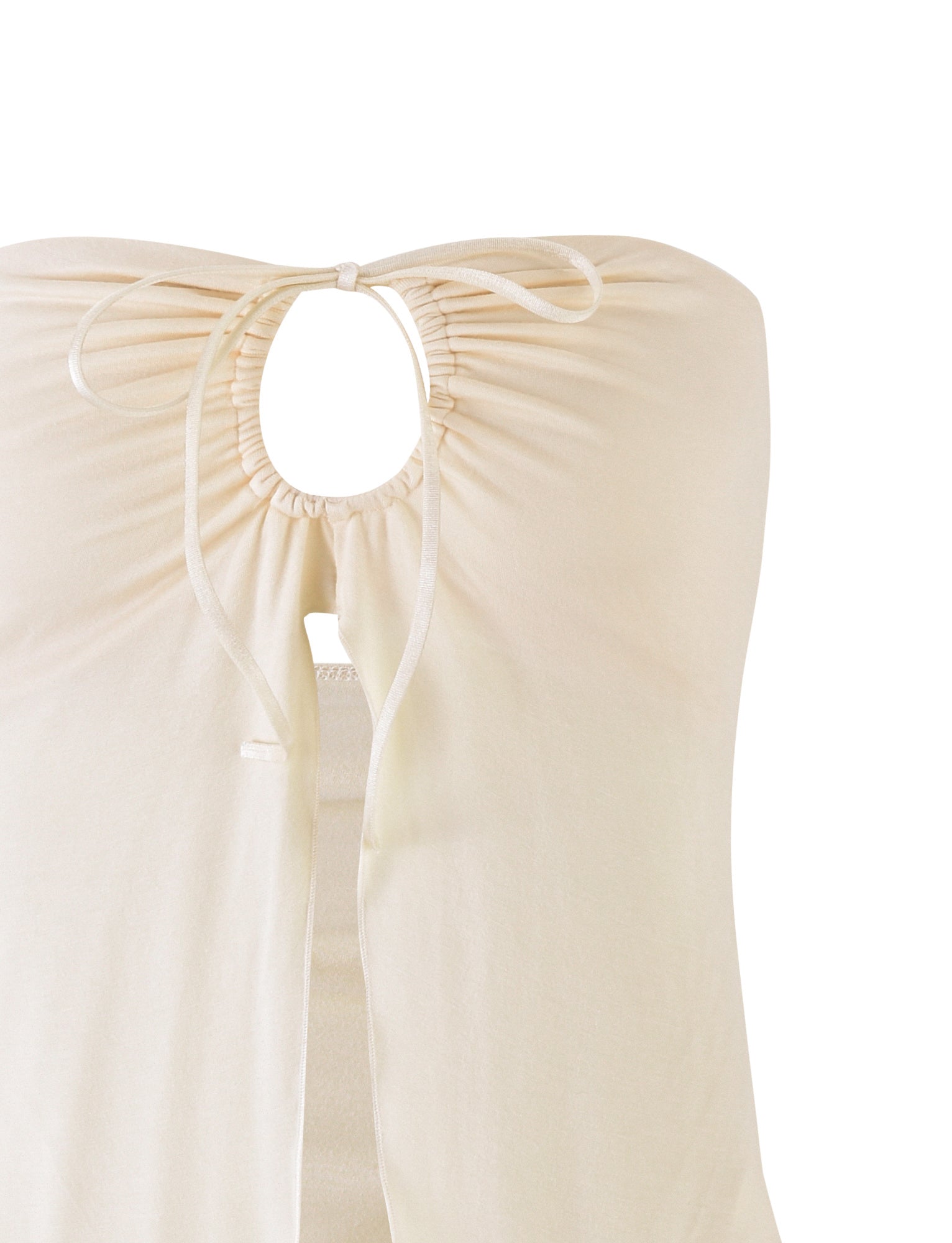 Close-up of the KAROLINA JERSEY TOP from TIGERMIST, featuring an off-white or ivory sleeveless design with a gathered keyhole neckline. The fabric drawstrings are neatly tied into a small bow at the top of the keyhole. The garment appears soft and lightweight, perfect for warm weather. The background is white.