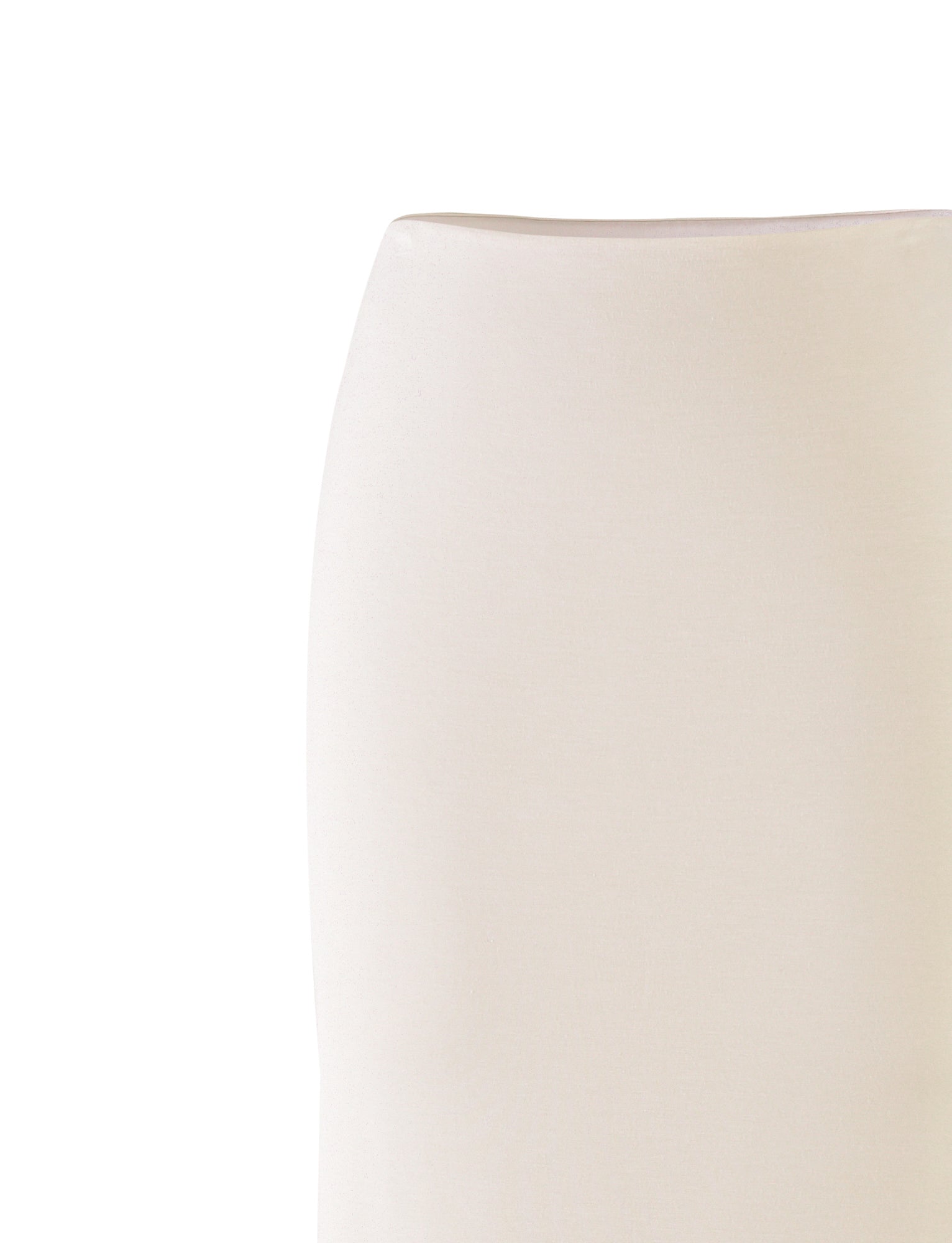 A close-up image of the backrest of an off-white KAROLINA JERSEY SKIRT by TIGERMIST, highlighting its smooth, minimalist design against a white background. The skirt exhibits a slightly curved silhouette, presenting a modern and elegant aesthetic.