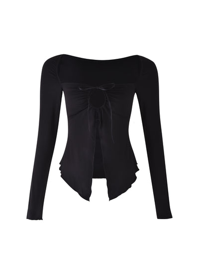 The KAROLINA JERSEY LONG SLEEVE TOP - BLACK from TIGERMIST boasts a square neckline and a central cut-out detail below the chest, adorned with a small bow. Featuring an asymmetrical hem with ruffled edges, this long-sleeved top offers a stylish and unique look.