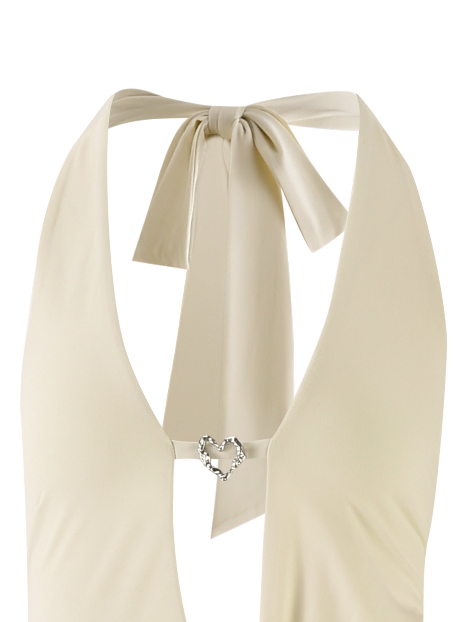 Close-up of a butter-yellow Tiger Mist AYA Maxi Dress with a deep V-neck. The dress ties at the back with a bow and features a small heart-shaped embellishment at the center of the front neckline.