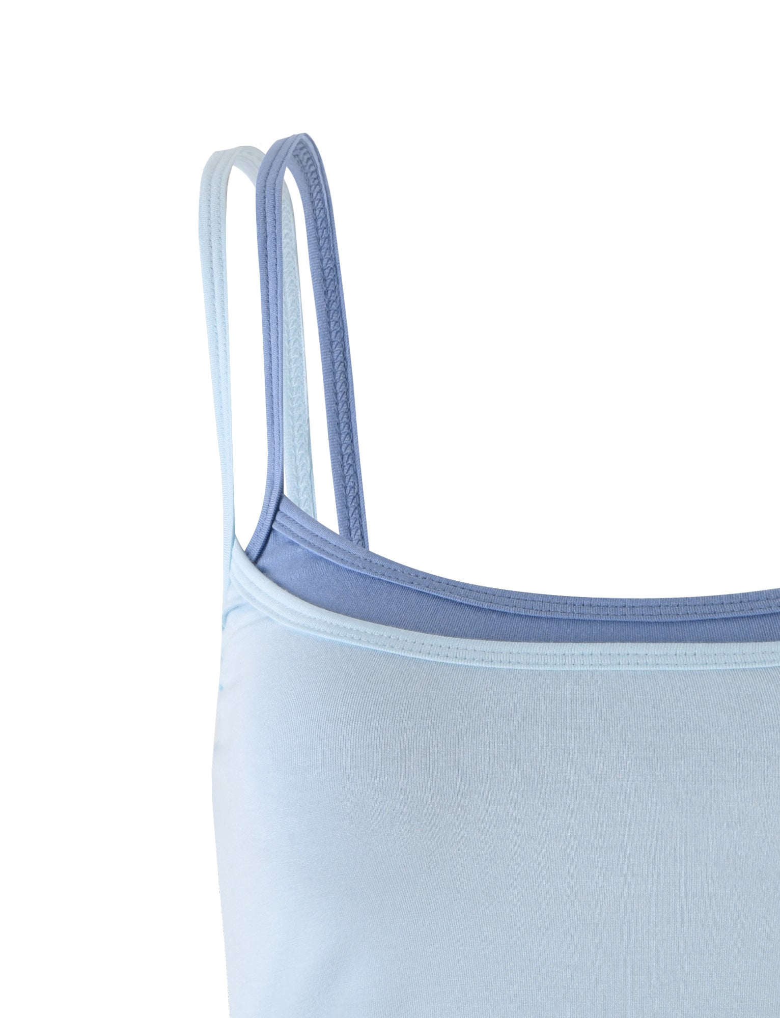 Close-up of a light blue TIGERMIST ADAIR TOP featuring thin double shoulder straps. The fabric appears smooth and stretchy, designed for a snug fit. The image focuses on the upper part of the top, showcasing the straps and neckline.