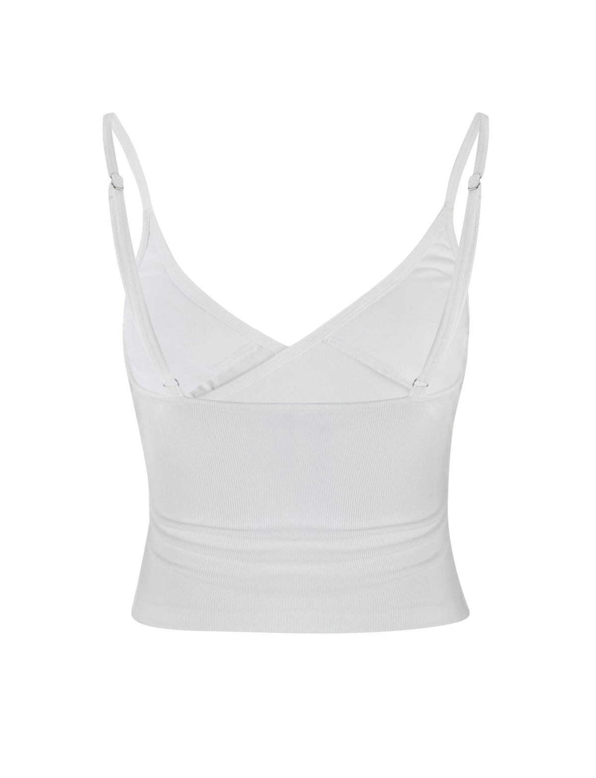 An image of the REY TOP - WHITE by TIGERMIST, a sleeveless crop top featuring adjustable spaghetti straps and a V-neck design. The top has a fitted look and is made from lightweight fabric, with a V-shaped back that offers a simple and clean style.