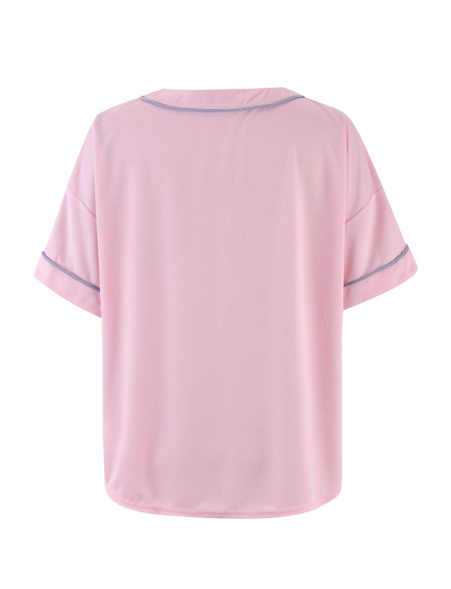 The ZEA TOP - PINK : BABY PINK by TIGERMIST is a light pink short-sleeve blouse with a subtle blue trim on the collar and sleeve cuffs. Made from soft, lightweight fabric, it perfectly captures Tiger Mist’s signature blend of comfort and style.